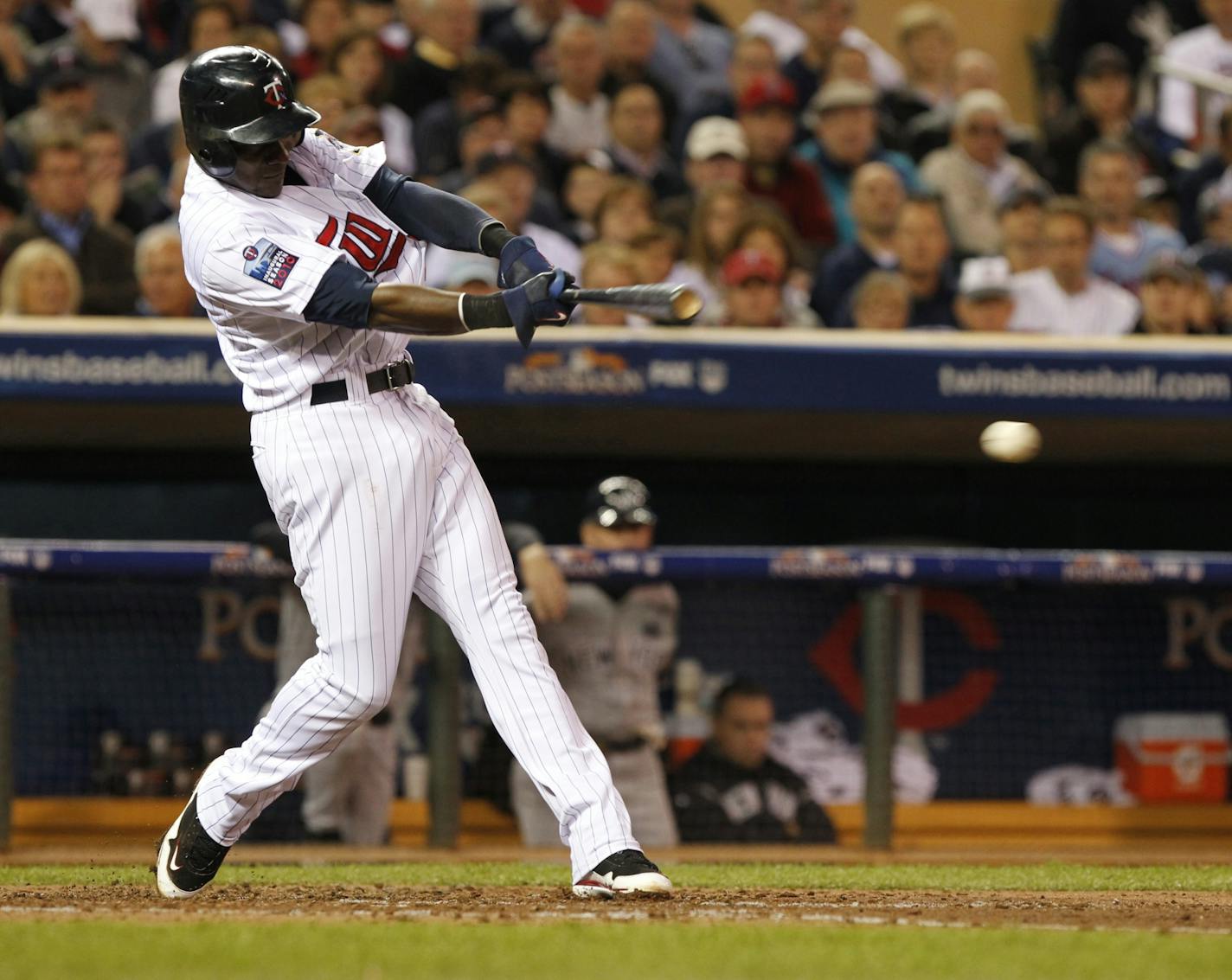 Minnesota's Orlando Hudson (1)gets a base hit in the third inning. He later scored giving the Twins a 3-0 lead Wednesday night.