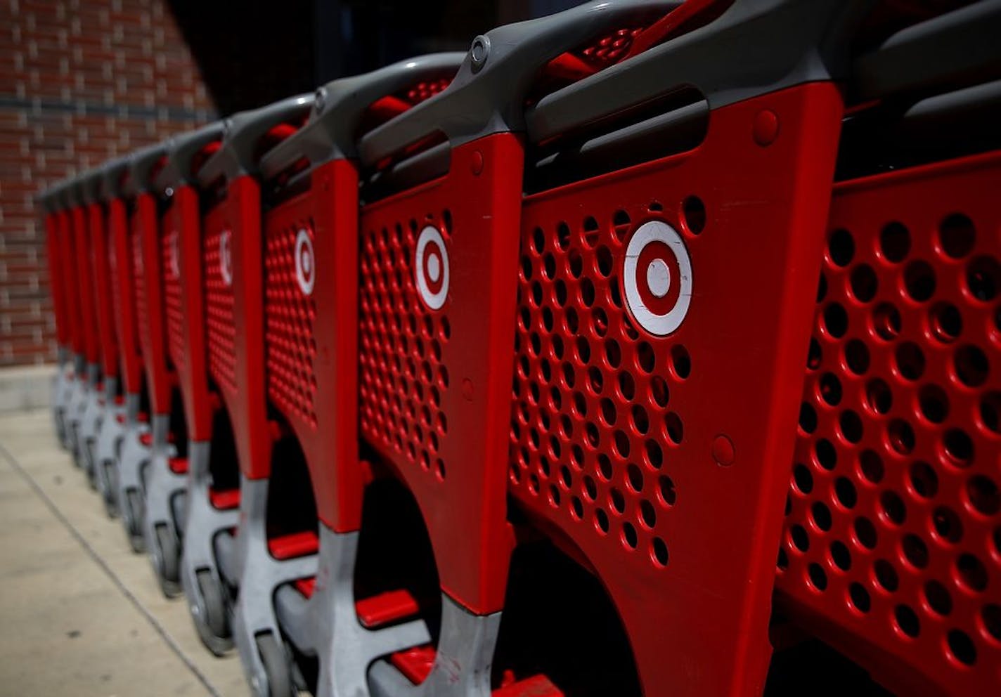 In this file image, the Target logo is displayed on shopping carts outside of Target store in California.