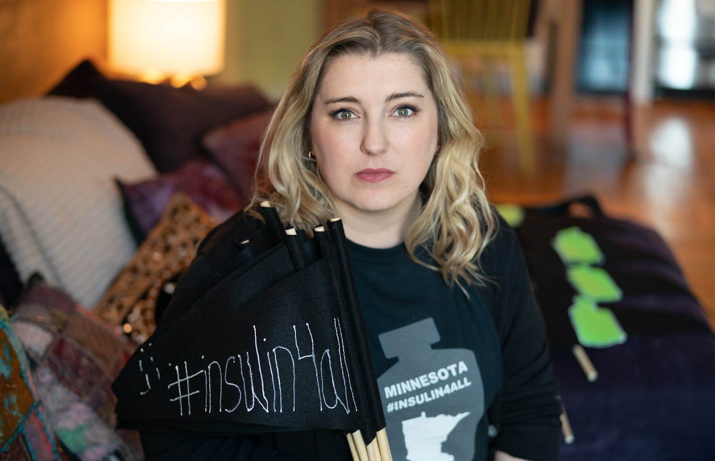 Quinn Nystrom, a diabetes activist, prepared 150 pennants for a diabetes rally to be held in the State Capitol Tuesday, March 5, at noon. ] GLEN STUBBE &#x2022; glen.stubbe@startribune.com Wednesday, February 27, 2019 EDS, she was preparing the pennants in her Minneapolis apartment.