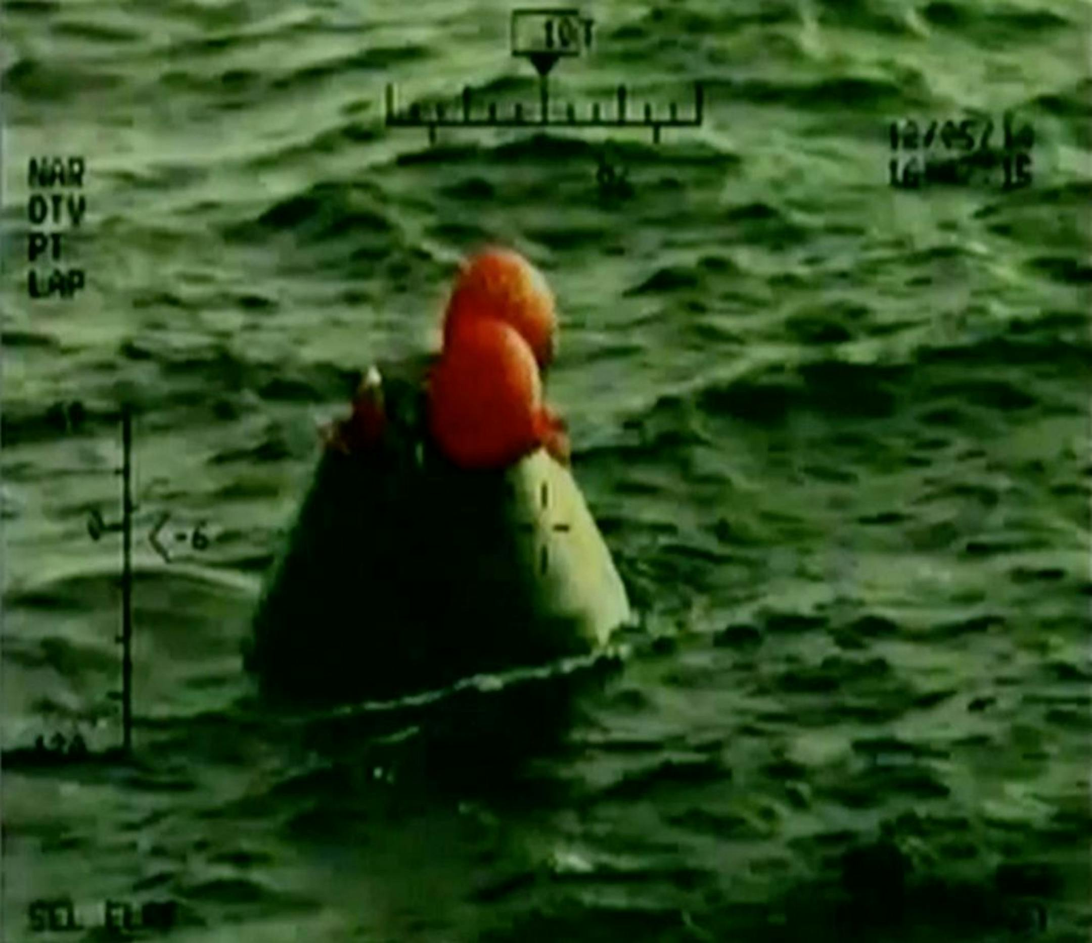 In this frame grab from NASA-TV, the Orion capsule floats after splashing down in the Pacific Ocean, Friday, Dec. 5, 2014, following a dramatic test flight that took it to a zenith height of 3,600 miles and ushered in a new era of human exploration aiming for Mars.