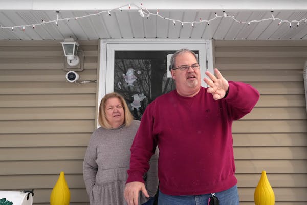 Peter Milton and his wife, Kathi, talk about the Ring camera they had installed outside their Richfield home last week. They got it a few years ago af