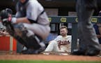 Brian Dozier watched the 9th inning from the dugout.