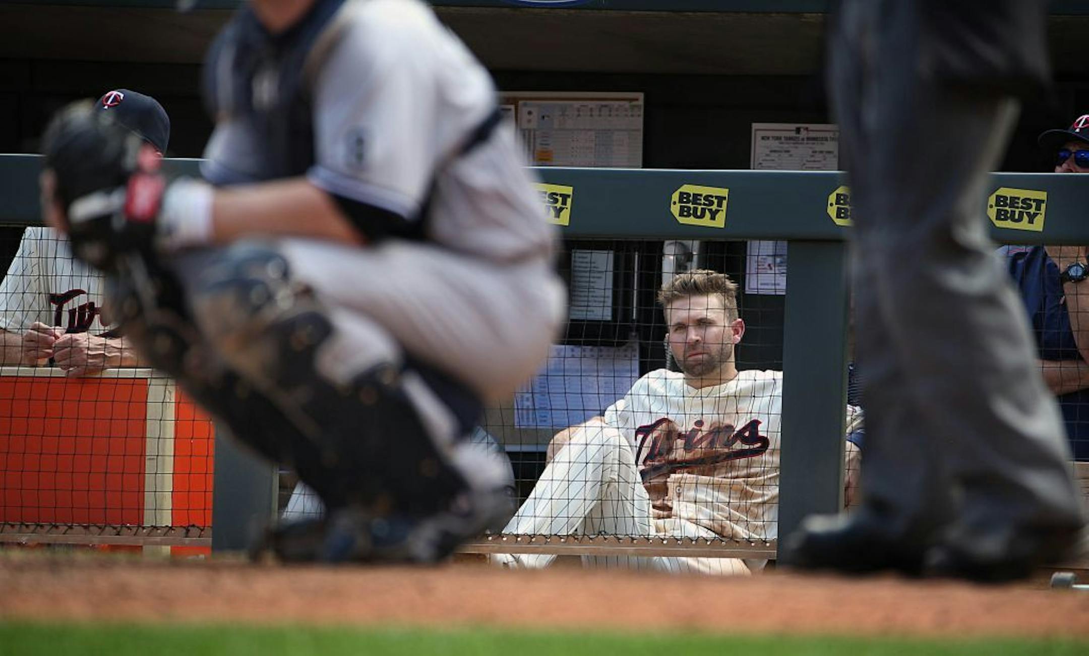 Brian Dozier watched the 9th inning from the dugout.