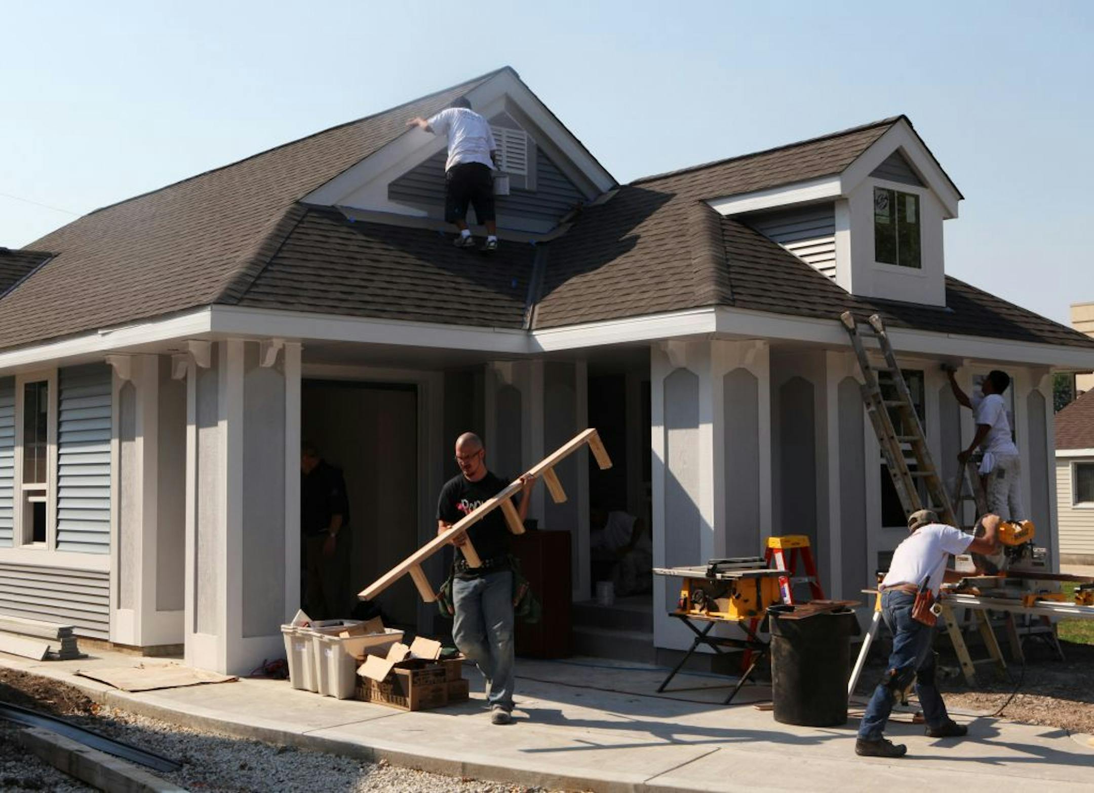 Miracle Homes is developing tiny, 1,000-sq-ft homes Miracle Homes' owner, Tom Hignite, calls the homes Mi-Pads to appeal to first-time homebuyers. They'll sell for $90,000 and they use what Hignite calls a "cruise ship design" that allows the owners to cram a lot of stuff into little space. Here, construction workers put together a ranch style home.