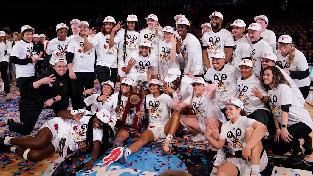 Louisville’s women’s basketball team celebrates after winning the Wichita regional final.