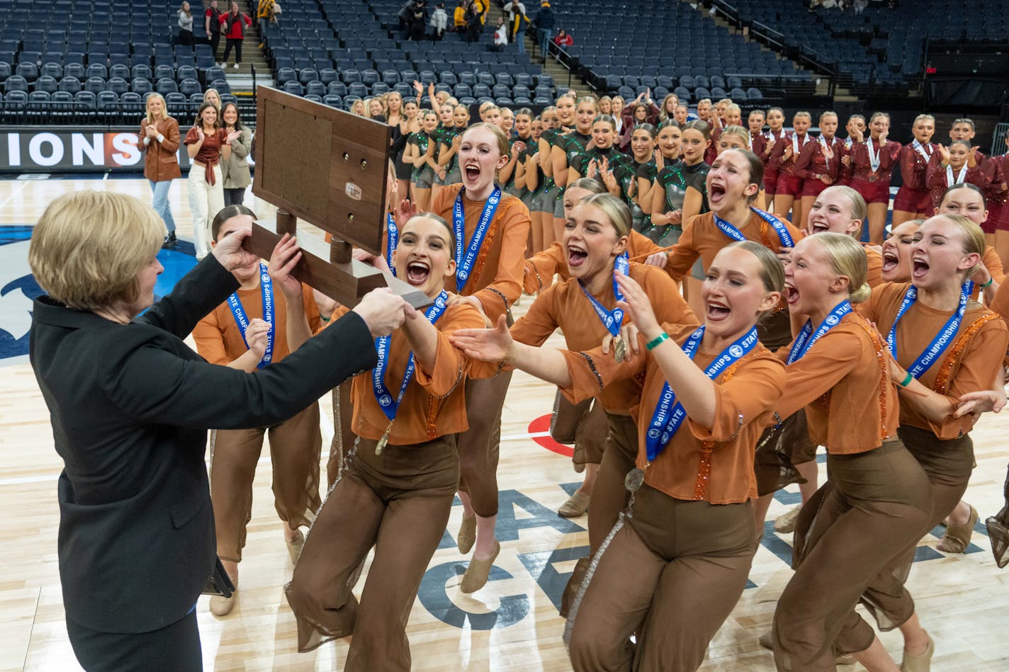 Maple Grove dancers celebrated Friday after they won the jazz state championship at the dance team state championships.wons the 2023 Class 3A State Championship performing to the song 'Hurt' at the 2023 MSHSL Class 3A Jazz Dance Tournament on Feb. 17, 2023 at the Target Center. [ Special to Star Tribune, photo by Matt Blewett, My Story Minnesota, matt@mystorymn.com, Feb. 17, 2023, MSHSL Dance Tournament, prep dance championships, Target Center, Minnesota, PREP021823.dance