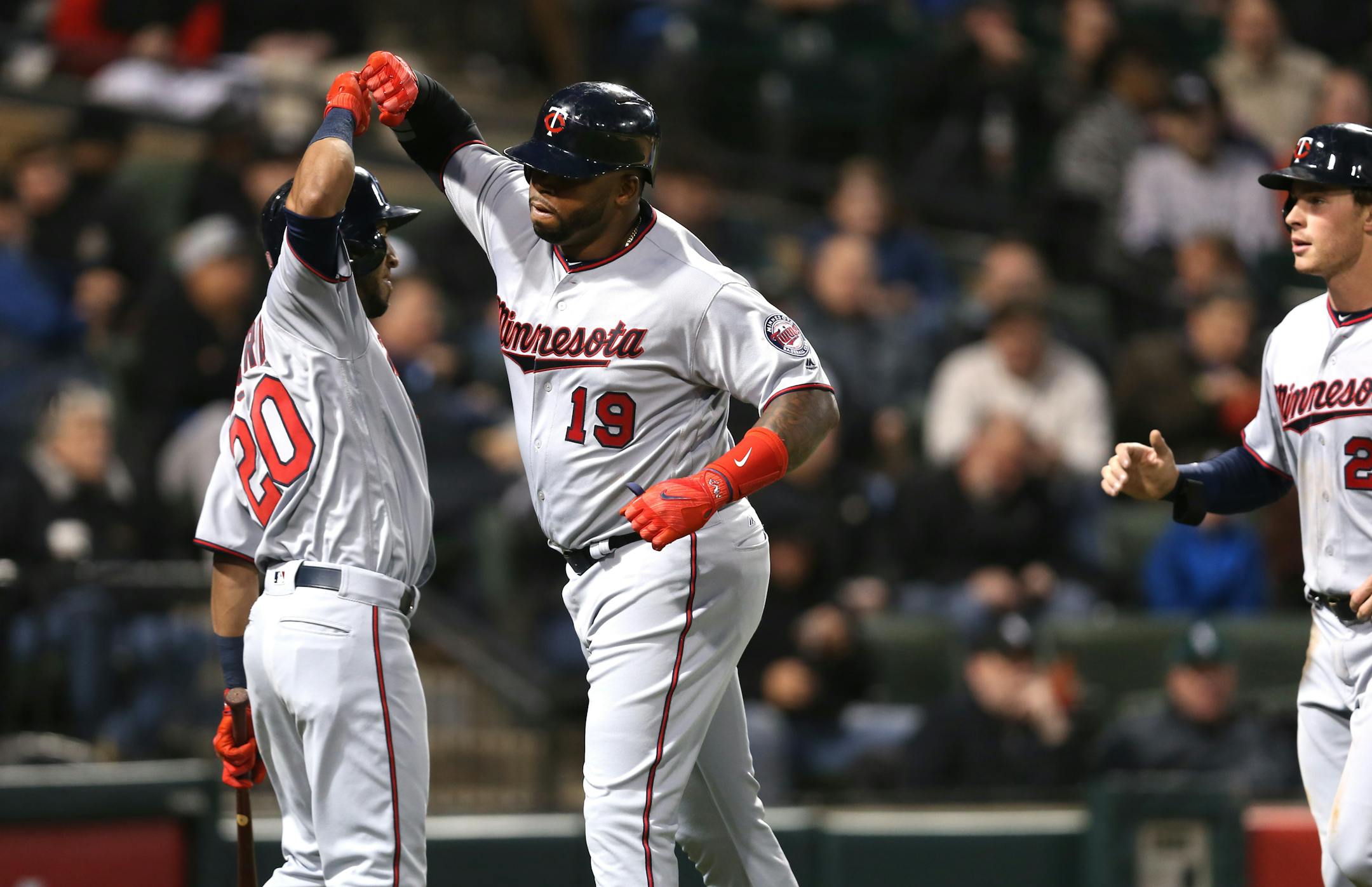 The Minnesota Twins' Kennys Vargas (19) is congratulated by teammate Eddie Rosario (20) after Vargas hit a two-run home run in the fourth inning against the Chicago White Sox at Guaranteed Rate Field in Chicago on Tuesday, May 9, 2017.