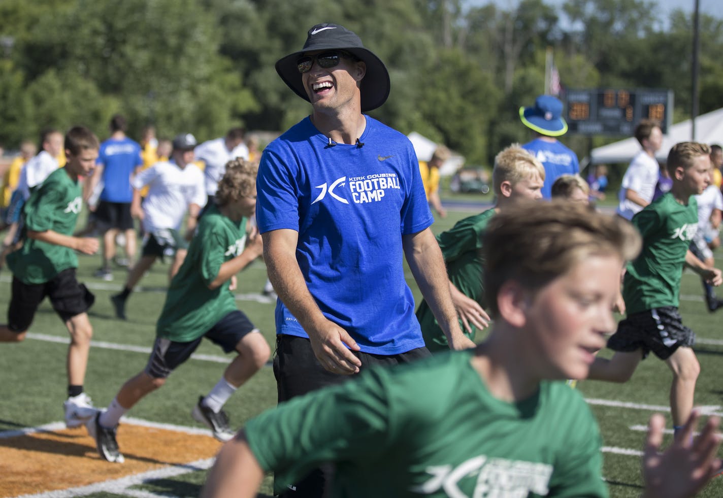 Vikings quarterback Kirk Cousin watched as kids warmed up at his football camp at Hope College Friday June, 29, 2018 in Holland , MI.