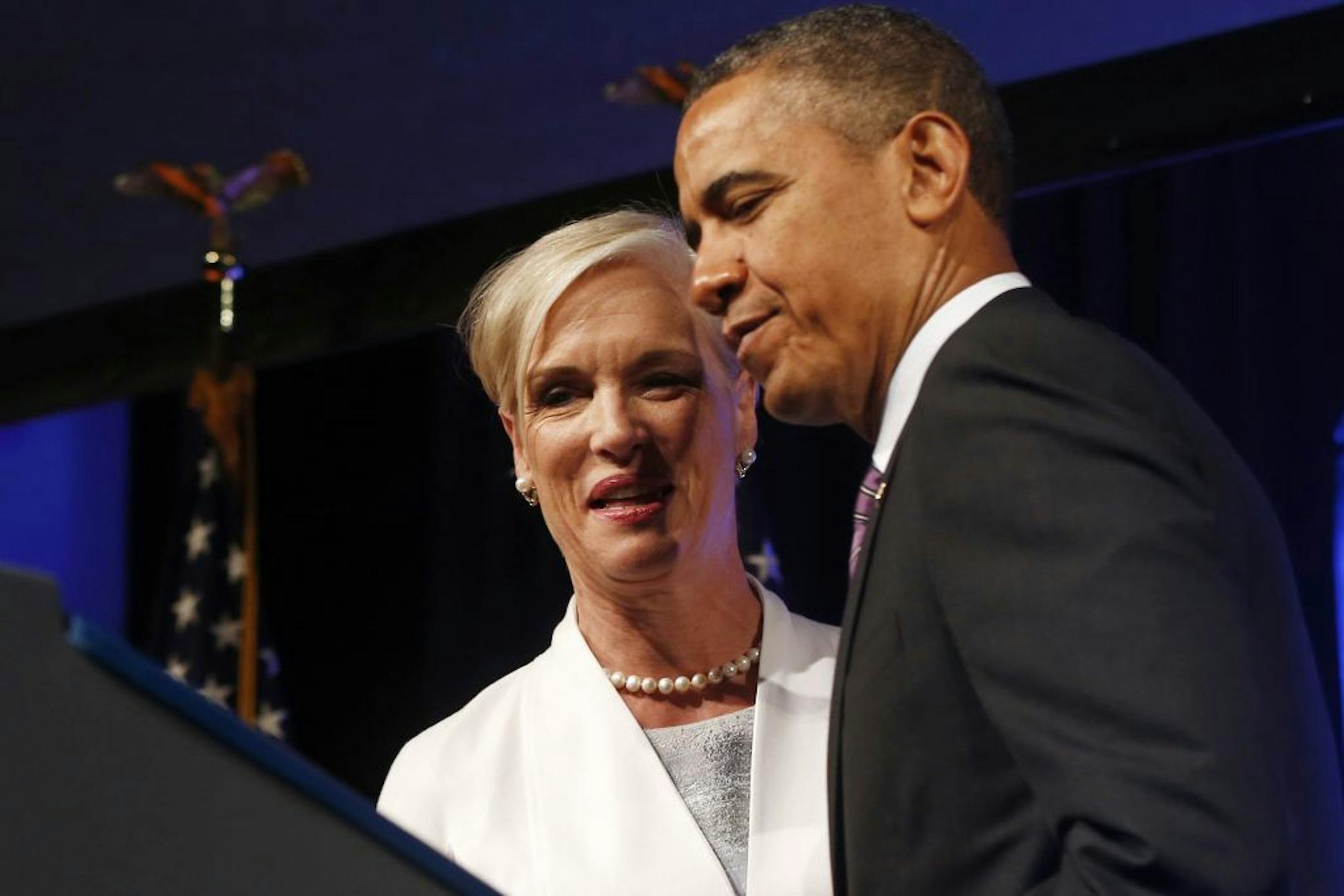 President Barack Obama is introduced by Cecilia Boone, chair of the board of Planned Parenthood, before speaking at the 2013 Planned Parenthood National Conference in Washington, Friday, April 26, 2013.