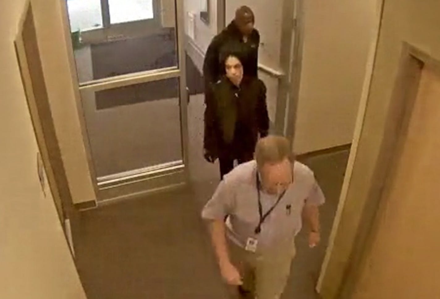 Prince, center, entered the clinic of Dr. Michael Schulenberg's clinic on April 20, 2016. Kirk Johnson is behind Prince.