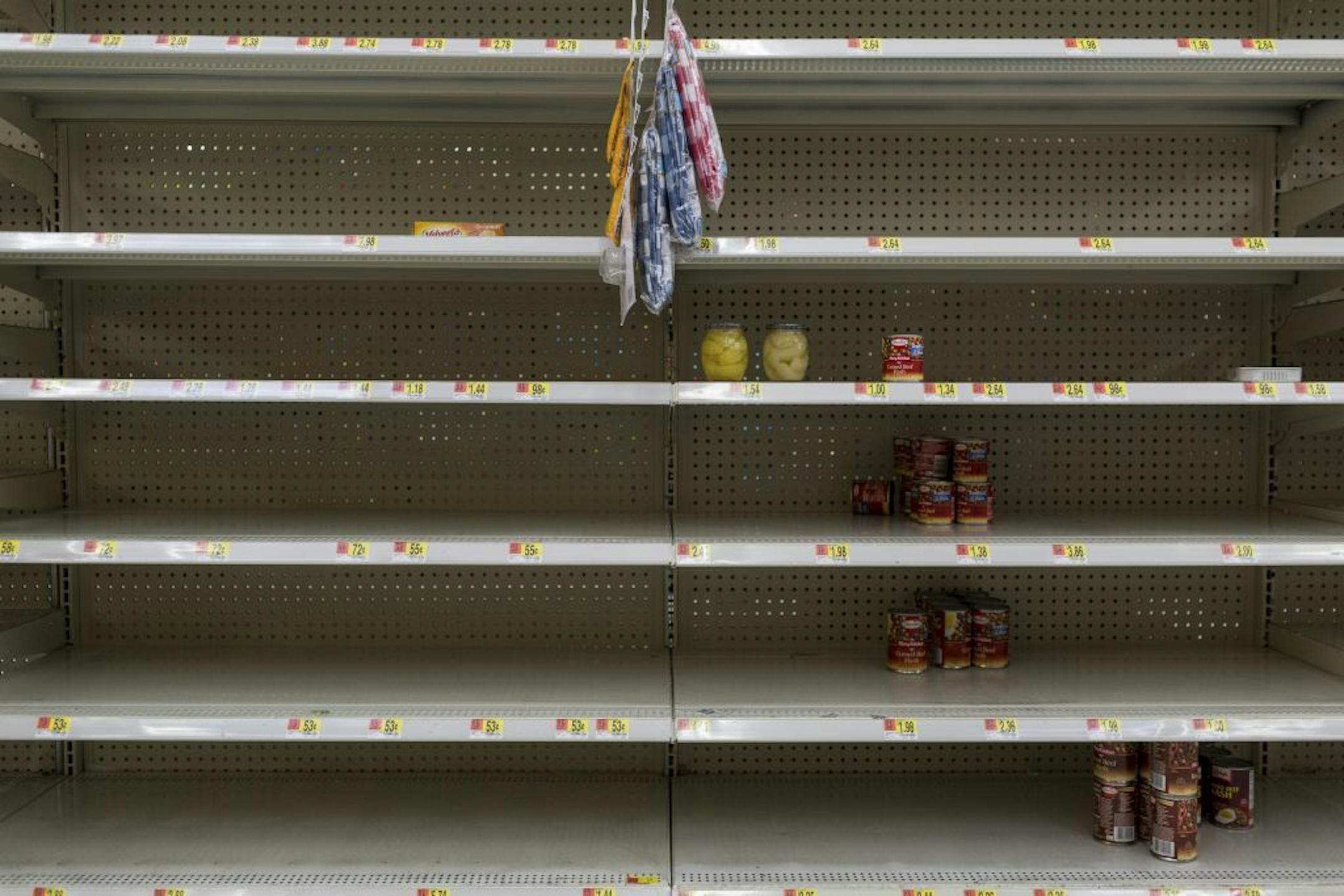 Near-empty shelves of canned foods at a WalMart store in Port St. Lucie, Fla., on Thursday. Minnesotans with homes or businesses in Florida are among those bracing for Hurricane Irma.