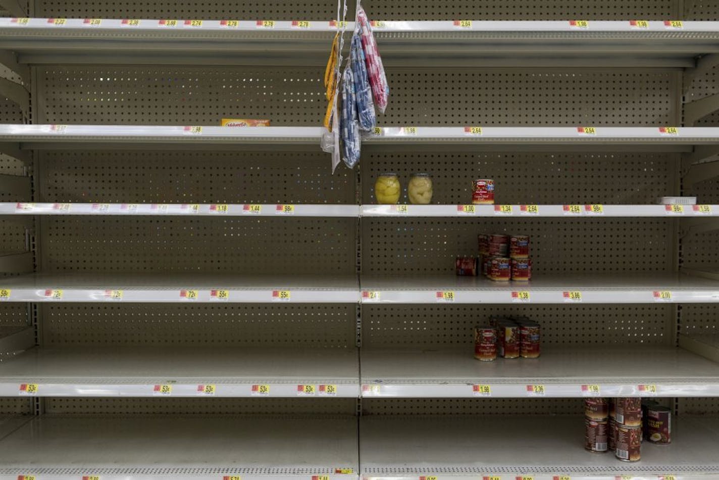 Near-empty shelves of canned foods at a WalMart store in Port St. Lucie, Fla., on Thursday. Minnesotans with homes or businesses in Florida are among those bracing for Hurricane Irma.