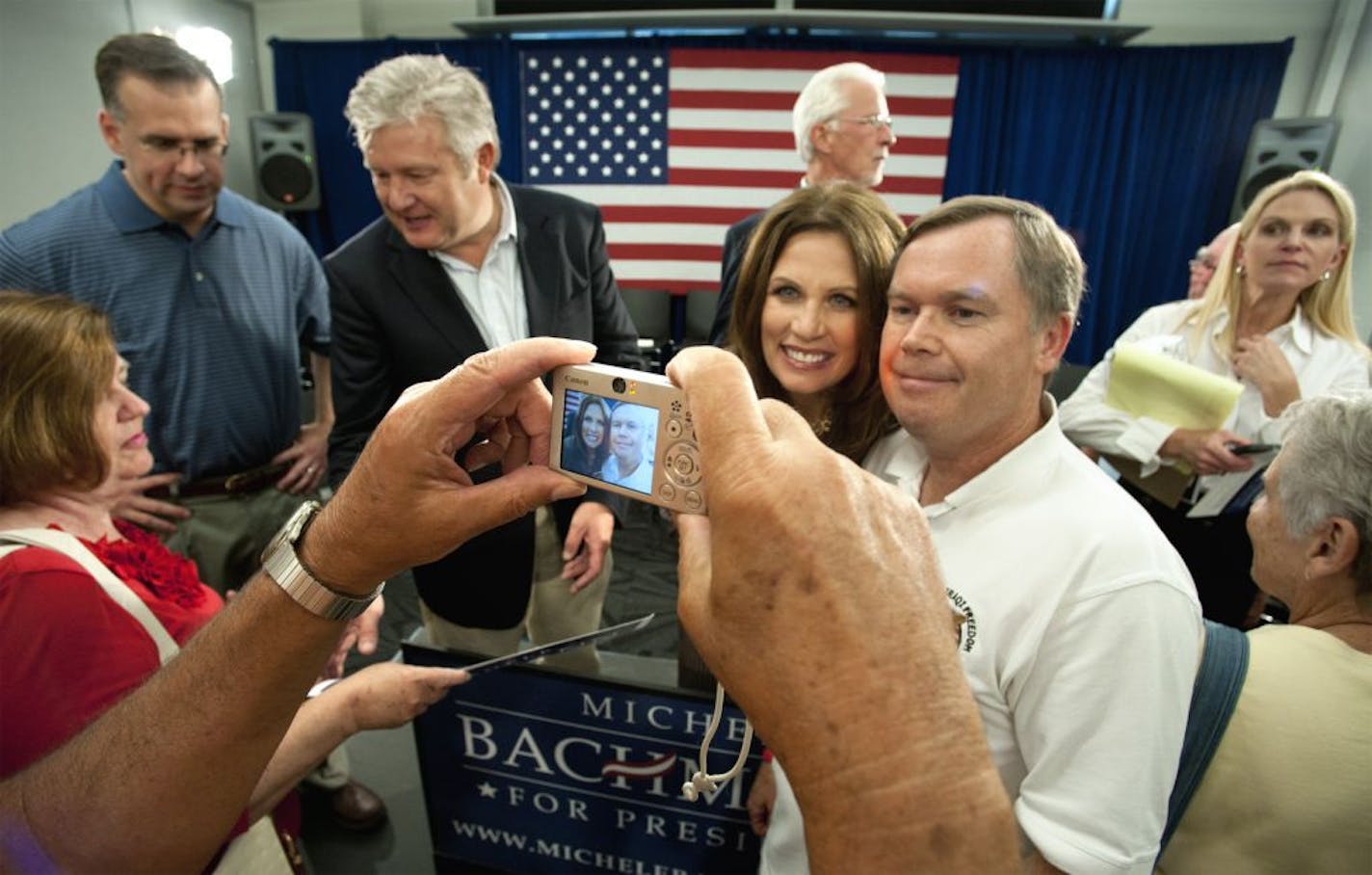 Presidential hopeful Rep. Michele Bachmann spoke to Iowans gathered in the Marshalltown Library, Saturday, July 23, 2011. Behind her on the left is her husand Marcus.