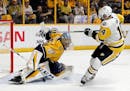 Nashville Predators goalie Pekka Rinne (35), of Finland, stops a shot by Pittsburgh Penguins left wing Chris Kunitz (14) during the second period in G