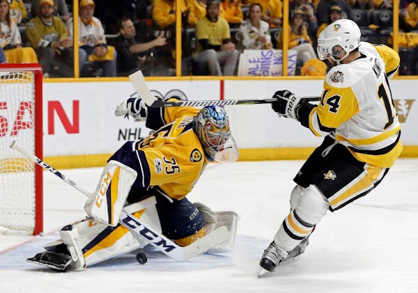 Nashville Predators goalie Pekka Rinne (35), of Finland, stops a shot by Pittsburgh Penguins left wing Chris Kunitz (14) during the second period in G