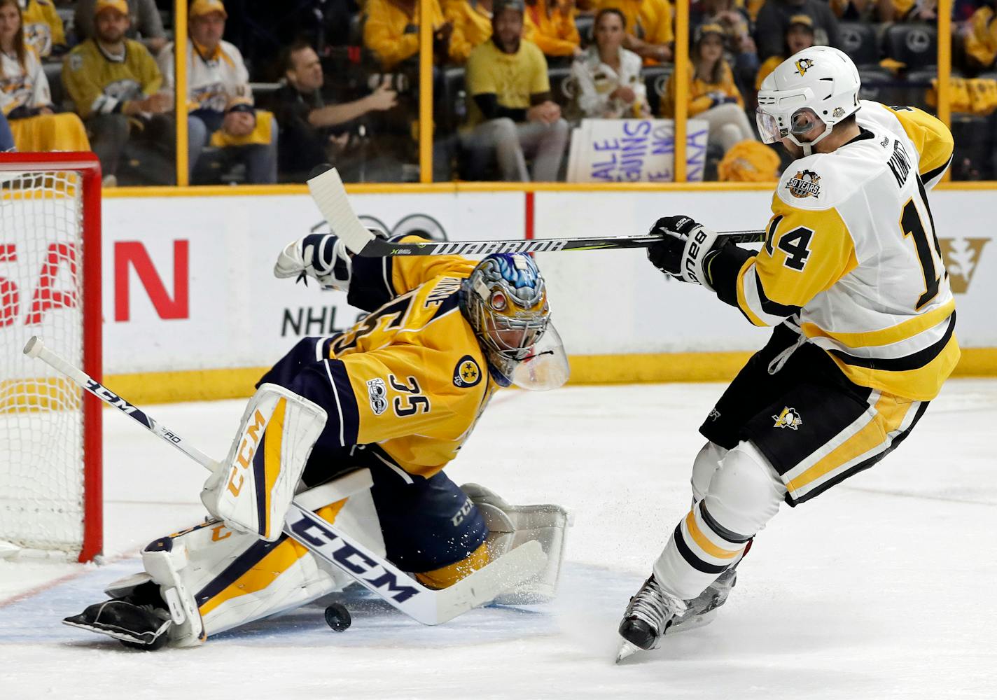 Nashville Predators goalie Pekka Rinne (35), of Finland, stops a shot by Pittsburgh Penguins left wing Chris Kunitz (14) during the second period in Game 4 of the NHL hockey Stanley Cup Finals Monday, June 5, 2017, in Nashville, Tenn.