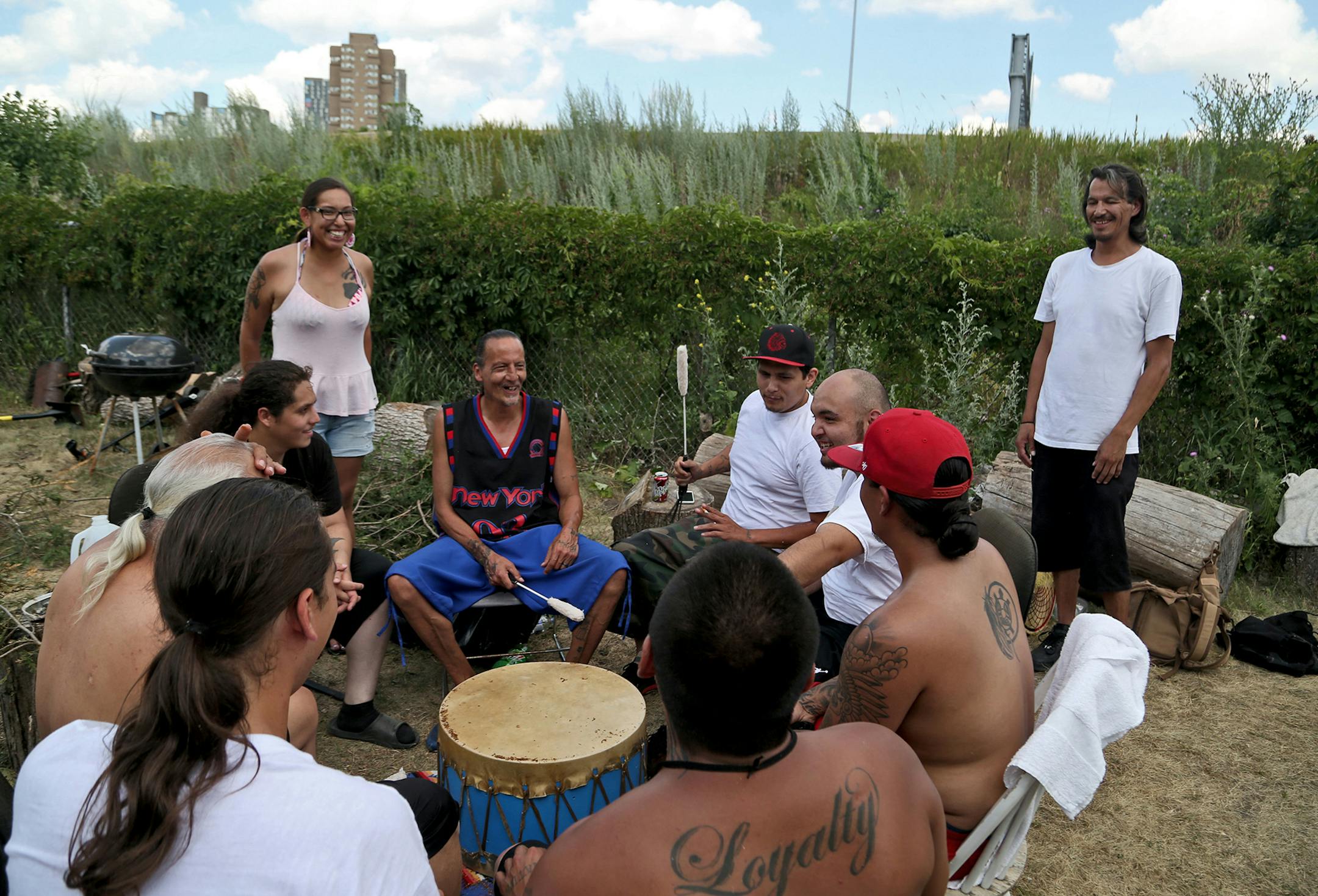 James Cross, the founder of the street outreach group Natives Against Heroin, spent nearly half of his life in prison for drug-related crimes but is working hard now to help people in his Native American community, particularly the poor and those with substance abuse problems. Here, Cross, center, sat down in a drum circle at a pre-sweat lodge ceremony he and NAH members held near the Minneapolis Indian Center Sunday, July 16, 2017, in south Minneapolis, MN. Some of those attending were recoveri