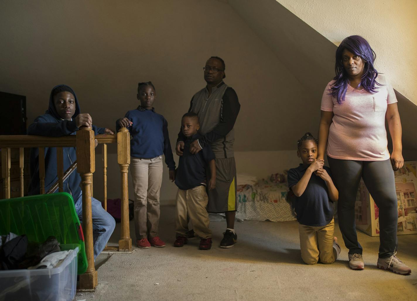 Kevin Woods and his wife, Tameca Richmond with their children, D.J., 13, Kertisha, 9, Decorian, 5, and Qintina, 8, in the upstairs room the two girls use as a bedroom. ] JEFF WHEELER &#xef; jeff.wheeler@startribune.com The 32 properties owned by Mahmood Khan, who had his rental licenses lifted by the city of Minneapolis last December, need repairs estimated to cost upwards of $2 million. Kevin Woods showed the problems in his home on Dupont Ave. N. Monday afternoon, March 19, 2018 in Minneapolis