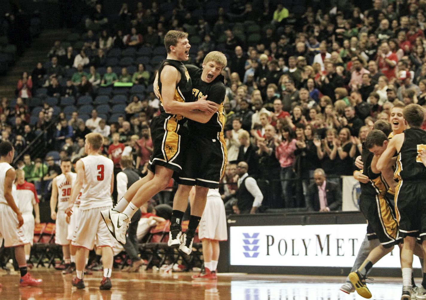 Southwest Minnesota Christian's Eric Talsma, middle left, and Kaleb Schelhaas, middle right, celebrate in flight after beating Maranatha Christian 81-73 in the boys state high school class 1A basketball finals Saturday, March 23, 2013, at the Target Center in Minneapolis, MN.] (DAVID JOLES/STARTRIBUNE) djoles@startribune.com boys state high school class 1A basketball finals Saturday, March 23, 2013, at the Target Center in Minneapolis, MN.** Eric Talsma, Kaleb Schelhaas,cq