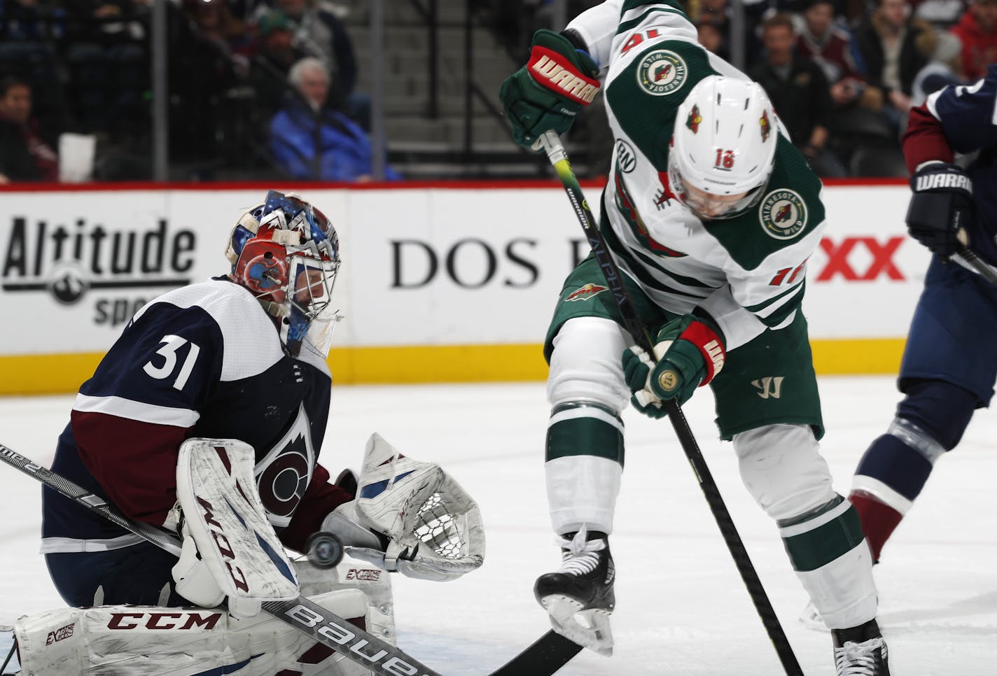 Wild left wing Jordan Greenway, right, redirects the puck into Colorado goaltender Philipp Grubauer in the second period