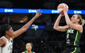 Lynx forward Alanna Smith gets a shot off against Liberty forward Jonquel Jones (35) in the first half Saturday. Smith has made 11 of her 17 three-poi