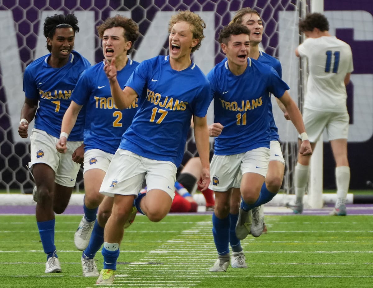 Tyler Baker (17) and his Wayzata teammates celebrated his overtime penalty kick that won Wednesday’s Class 3A semifinal.