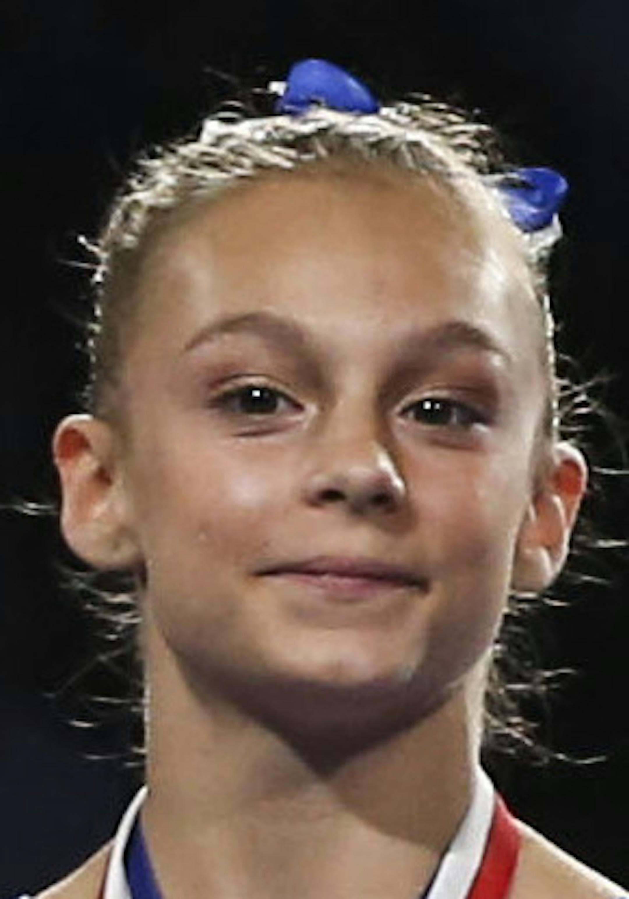 From L to R, Grace McCallum, Maile O'Keefe, and Leanne Wong celebrate after winning the junior women's vault at the U.S. gymnastics championships, Sunday, Aug. 20, 2017, in Anaheim, Calif. (AP Photo/Ringo H.W. Chiu) ORG XMIT: NYOTK