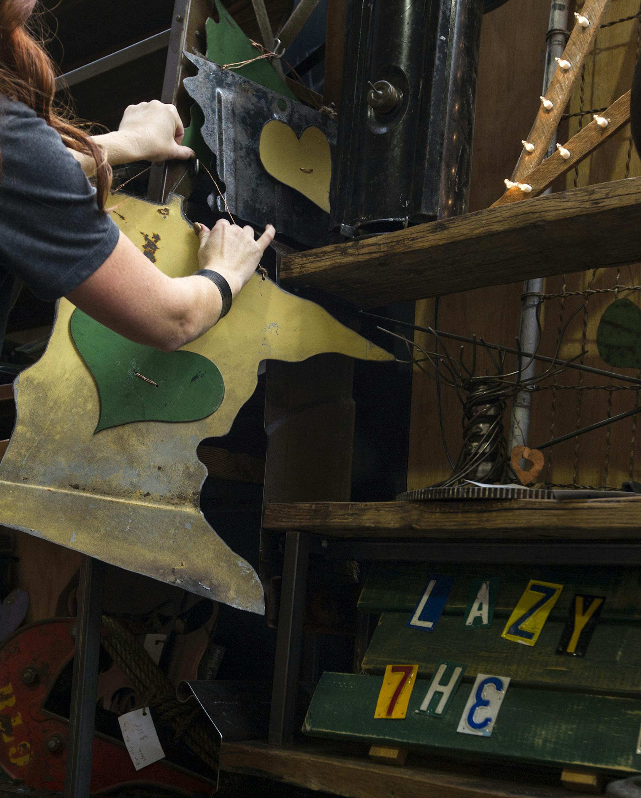 Minnesota-shaped signs are some of the many metal craft items sold by Des Moines-based Relics Awry at the Junk Bonanza at Canterbury Park in Shakopee September 26, 2013. The event features over 150 vendors and continues Friday and Saturday, 9am to 5pm. (Courtney Perry/Special to the Star Tribune)