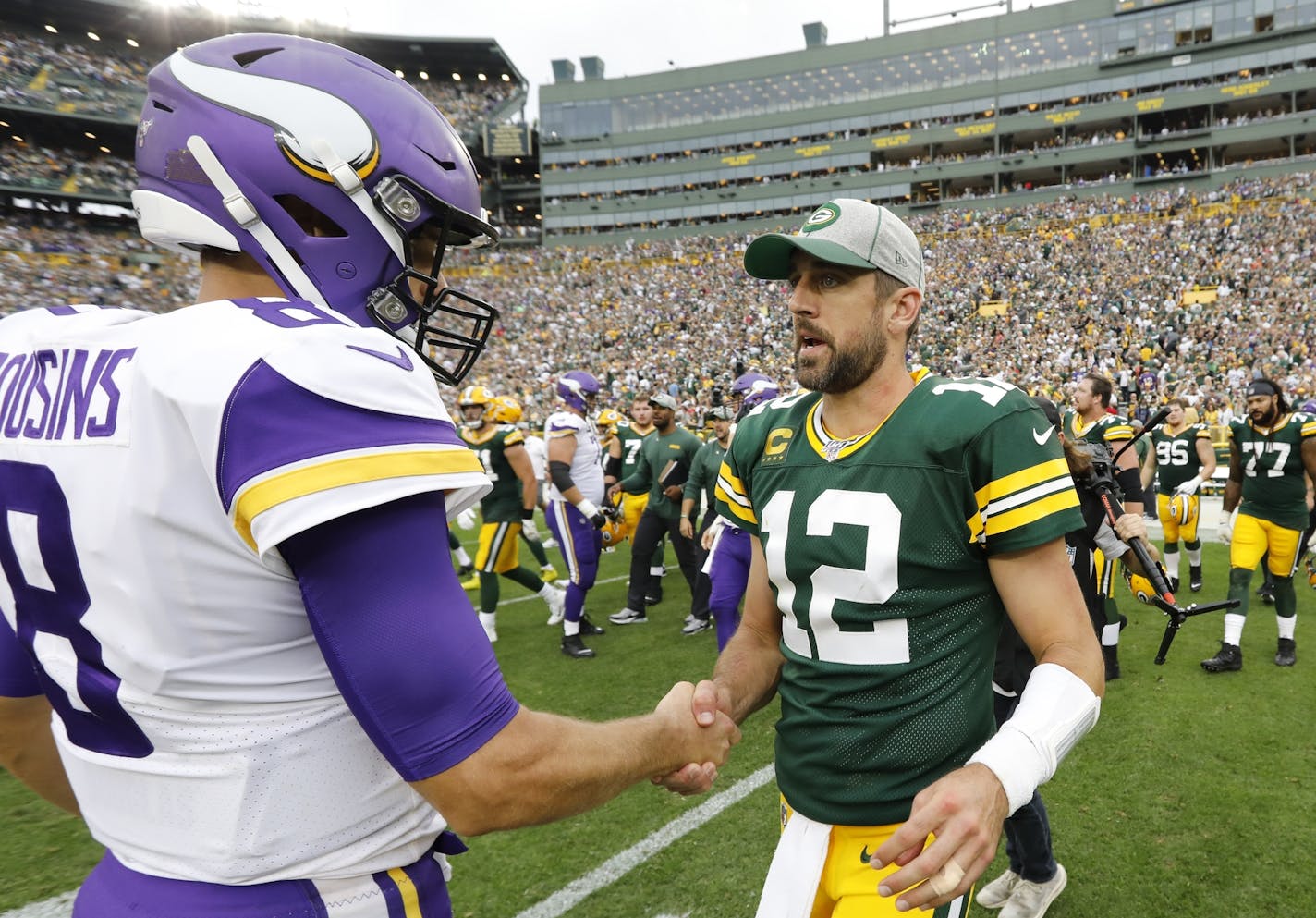 Green Bay Packers' Aaron Rodgers talks to Minnesota Vikings' Kirk Cousins after an NFL football game Sunday, Sept. 15, 2019, in Green Bay, Wis. The Packers won 21-16. (AP Photo/Mike Roemer)