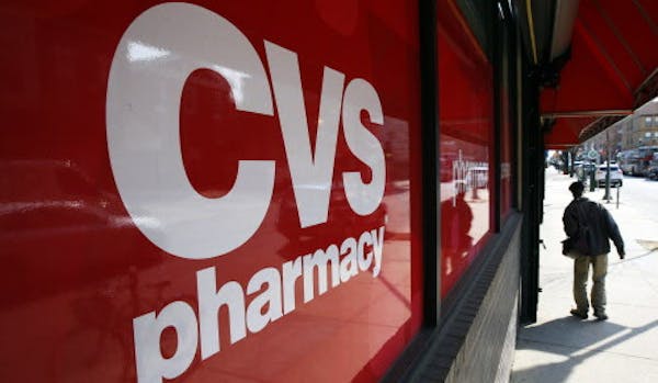 FILE - This March 25, 2014, file photo, shows a CVS store in Philadelphia. Target announced Monday, June 15, 2015, that it is selling its pharmacy and