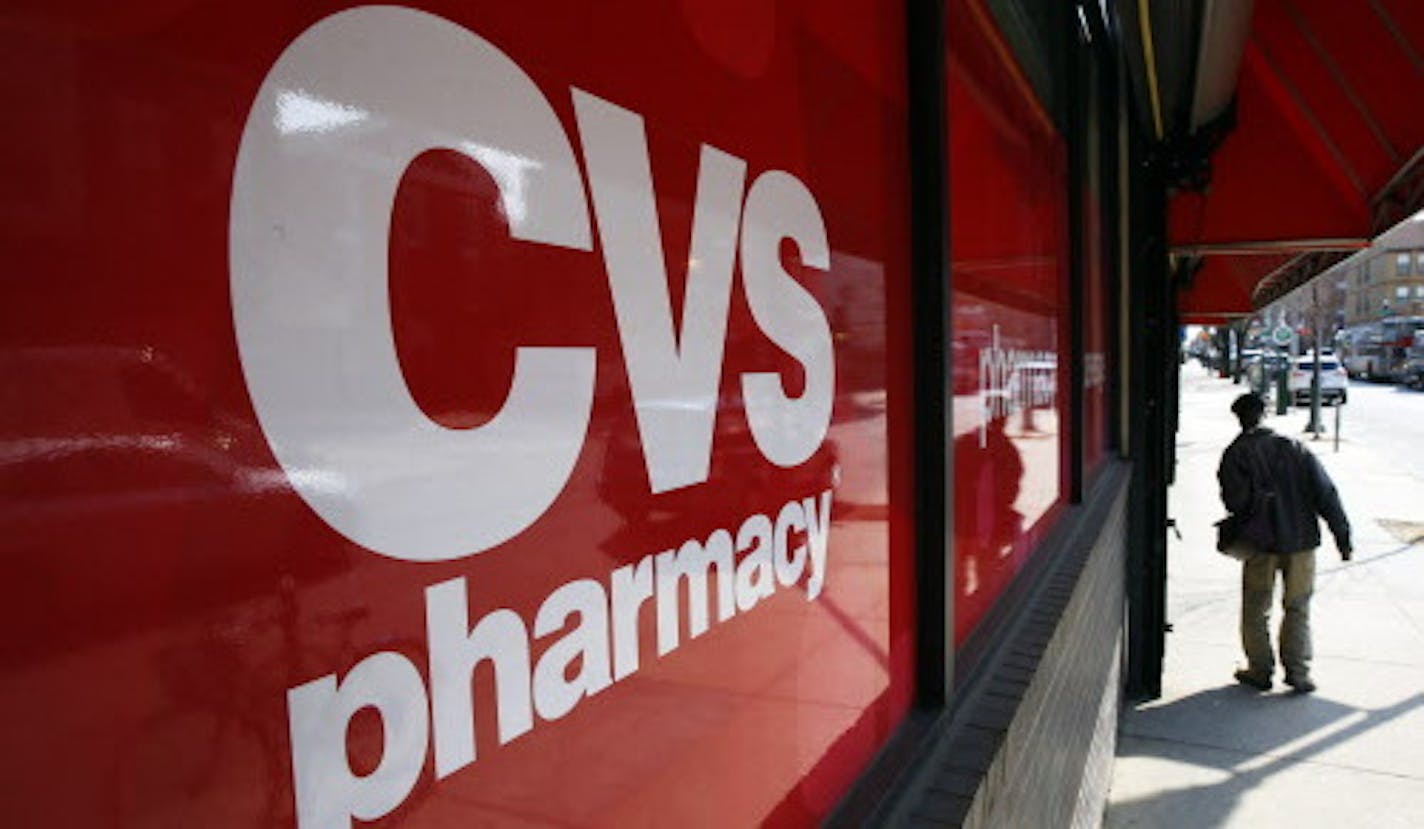 FILE - This March 25, 2014, file photo, shows a CVS store in Philadelphia. Target announced Monday, June 15, 2015, that it is selling its pharmacy and clinic businesses to drugstore chain CVS Health for about $1.9 billion in a deal that combines the resources of two retailers seeking to polish their reputations as health care providers.