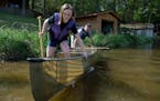 Caitlin Bell and her father, Ted Bell, founder and creator of Northstar Canoes, launched a canoe on Elk Lake in 2014. Northstar is one of nine plantif