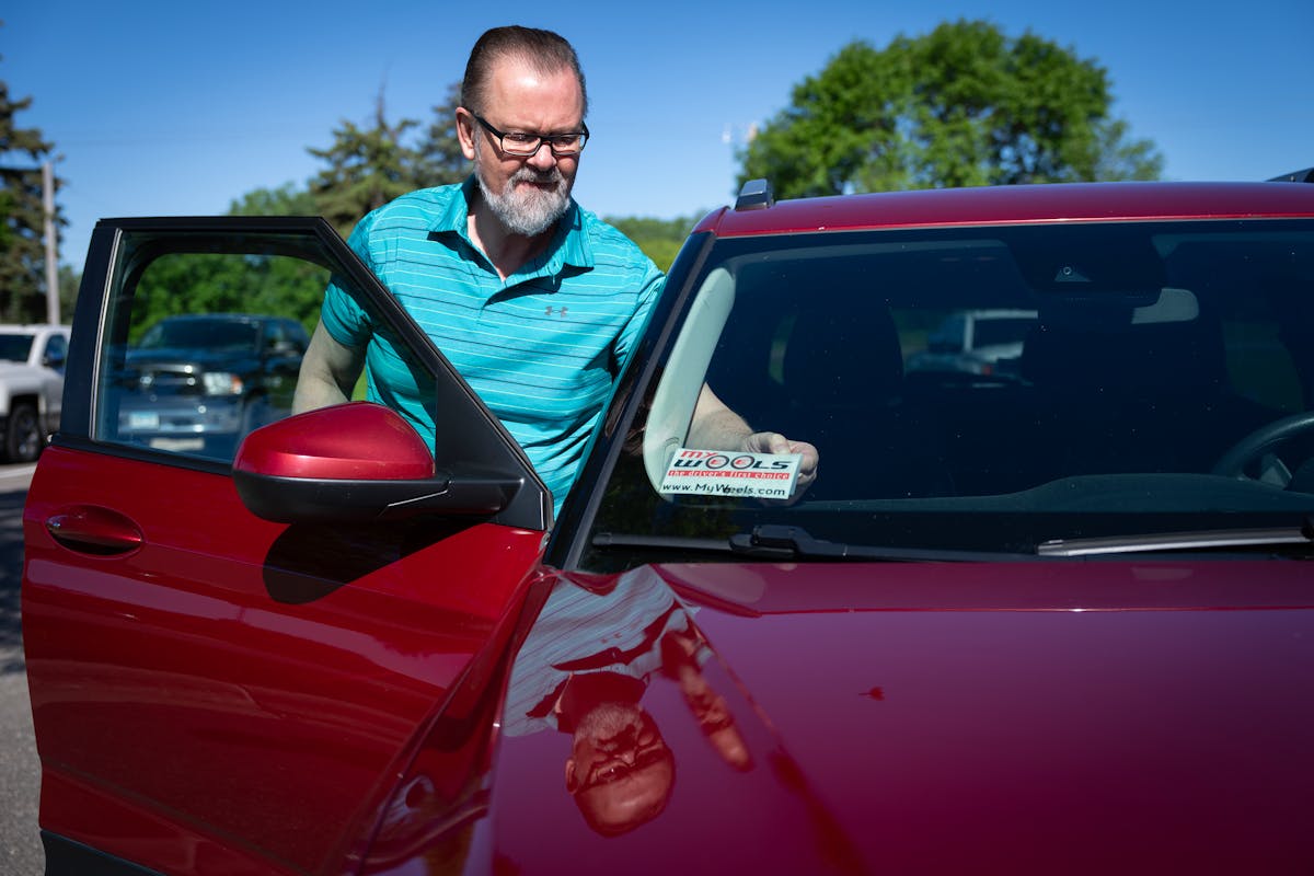 Steve Kull preps his vehicle Wednesday for a day of rideshare driving in Fridley. Kull has been driving nearly a year for Lyft, Uber and now Minnesota