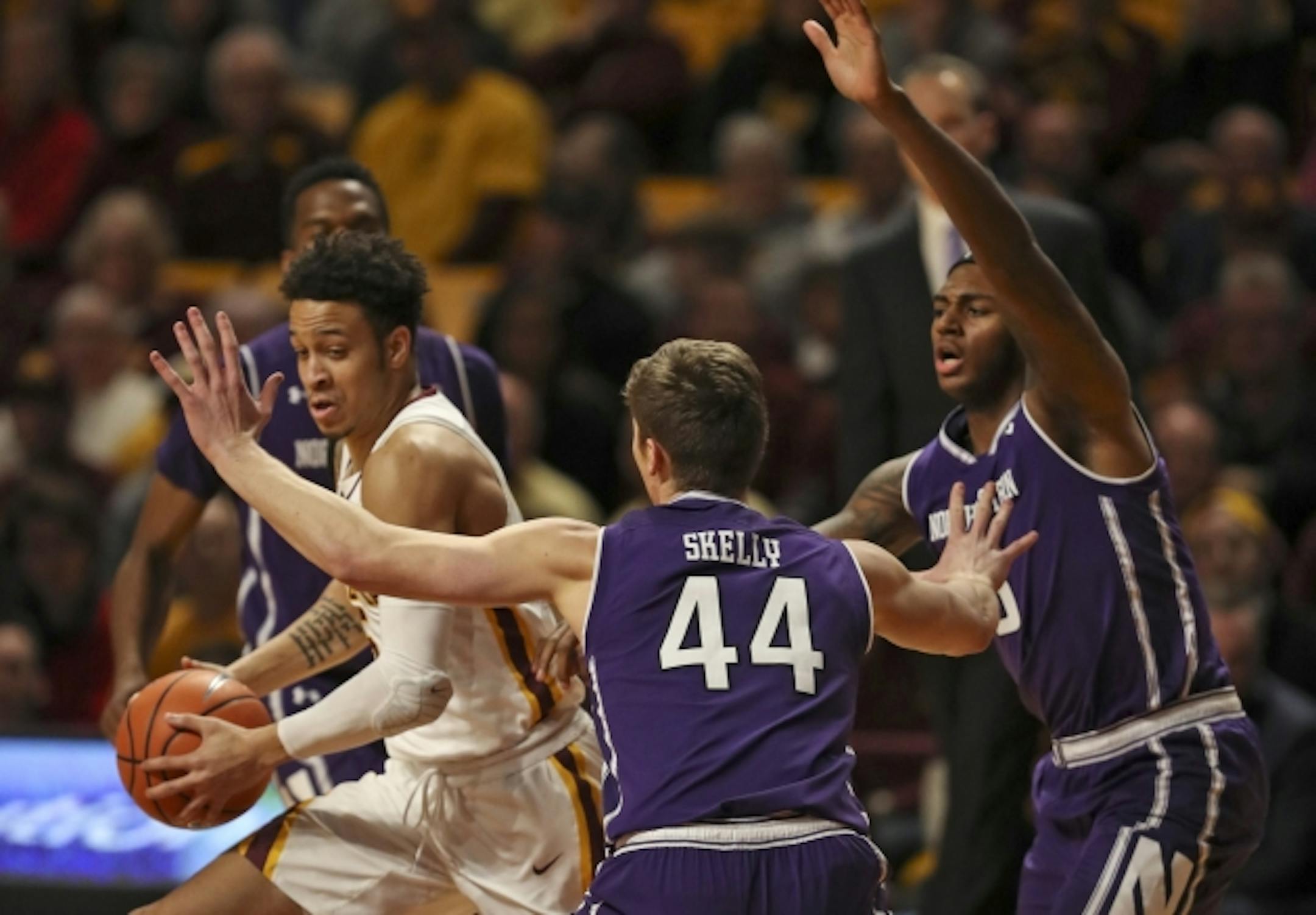 Gophers guard Amir Coffey dribbled away from Wildcats forward Gavin Skelly (44) and center Dererk Pardon (5) in the first half.    ]  JEFF WHEELER ' jeff.wheeler@startribune.com