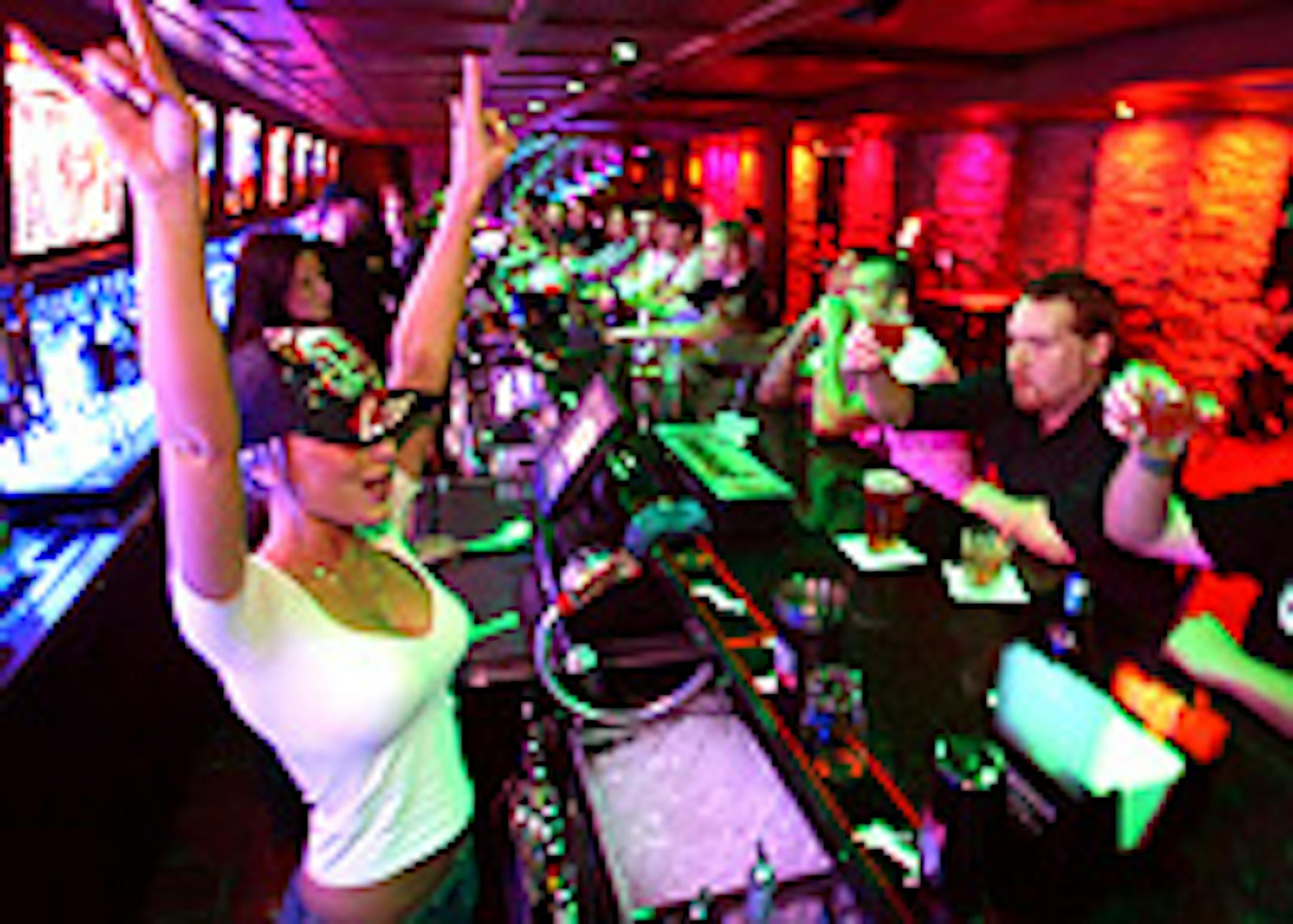 Bartender Courtney Haesner gets it going with a round of shots for Brian Phillips and friends.