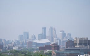 Smoke from Canadian wildfires lingers in the air over downtown Minneapolis on Monday, May 13, 2024.
