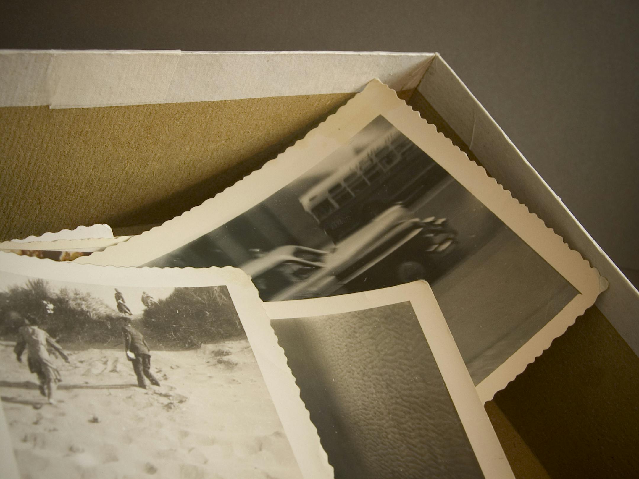 istockphoto.com old hand and moneyBox of old photos