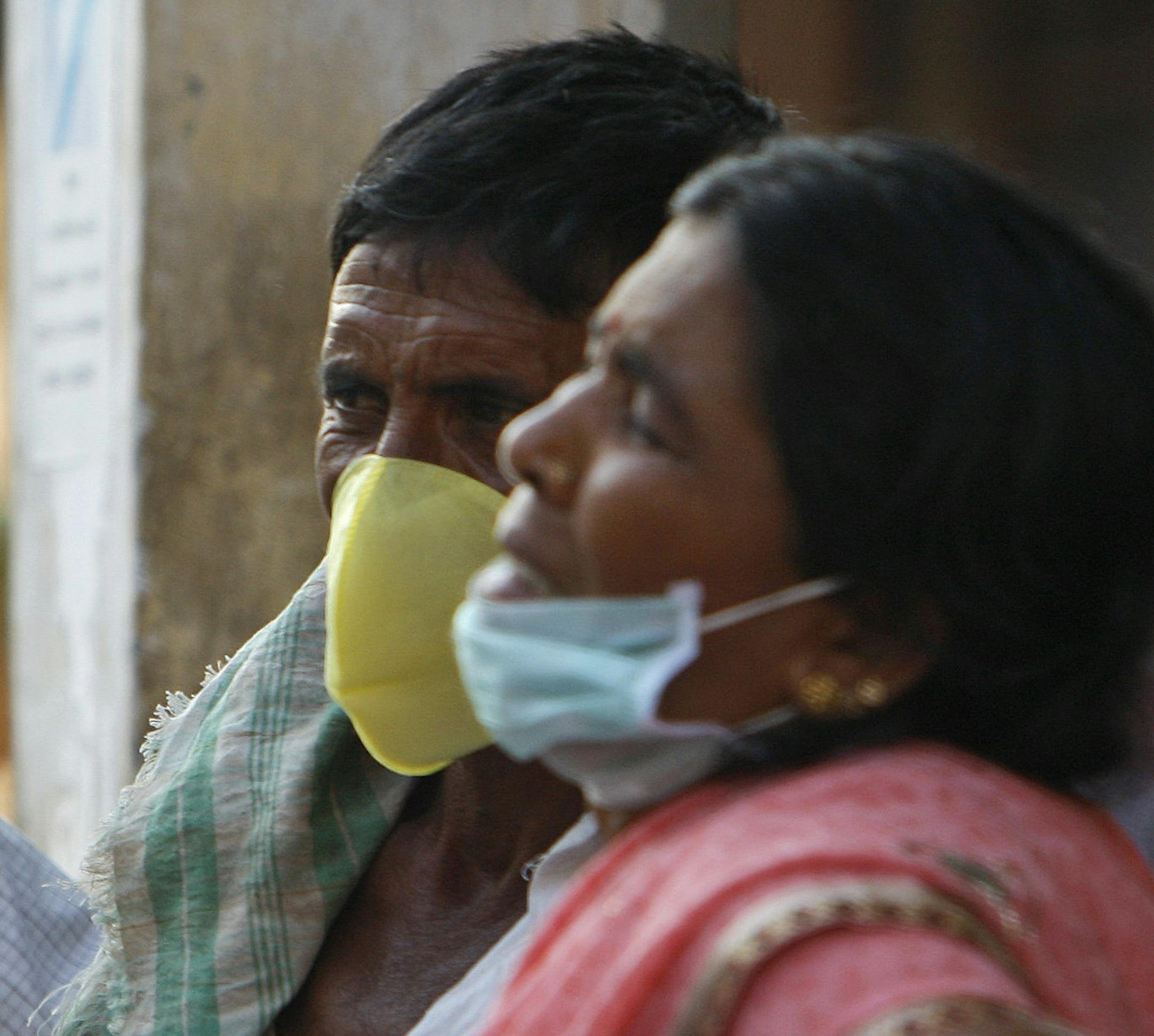 Indians cover their faces with masks as preventive measure against swine flu at the Gandhi Hospital in Hyderabad, in the southern Indian state of Telangana, Friday, Feb. 20, 2015. Health authorities were working to ensure remote hospitals in India had adequate medical supplies for a flu outbreak that has claimed more than 700 lives in 10 weeks. More than 11,000 cases have been reported since mid-December with most of the cases being reported from Rajasthan, Gujarat, Maharashtra, Telangana and Ma