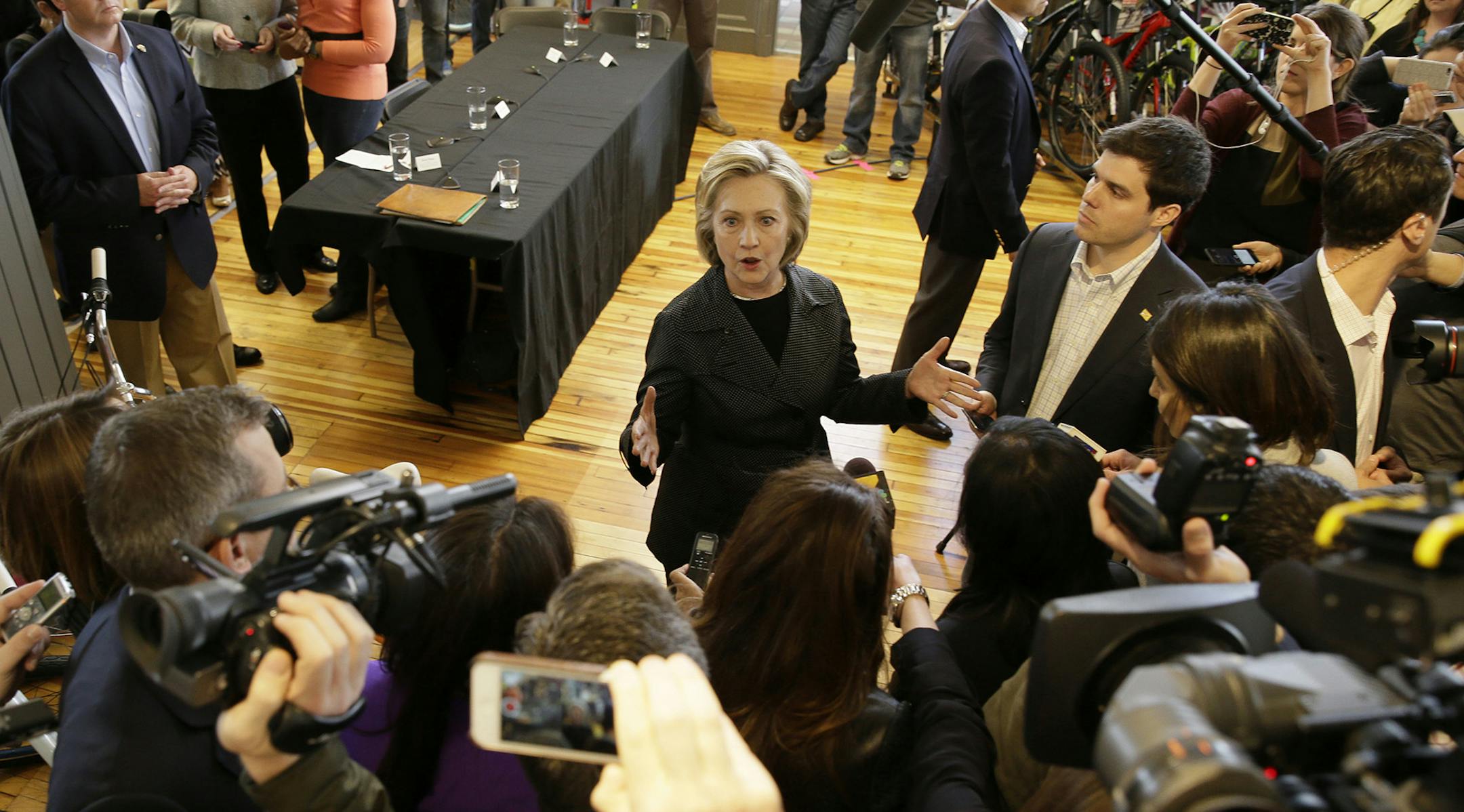 Democratic presidential candidate Hillary Rodham Clinton speaks to members of the media after meeting with small business owners, Tuesday, May 19, 2015, at the Bike Tech cycling shop in Cedar Falls, Iowa. (AP Photo/Charlie Neibergall) ORG XMIT: MIN2015052015585769