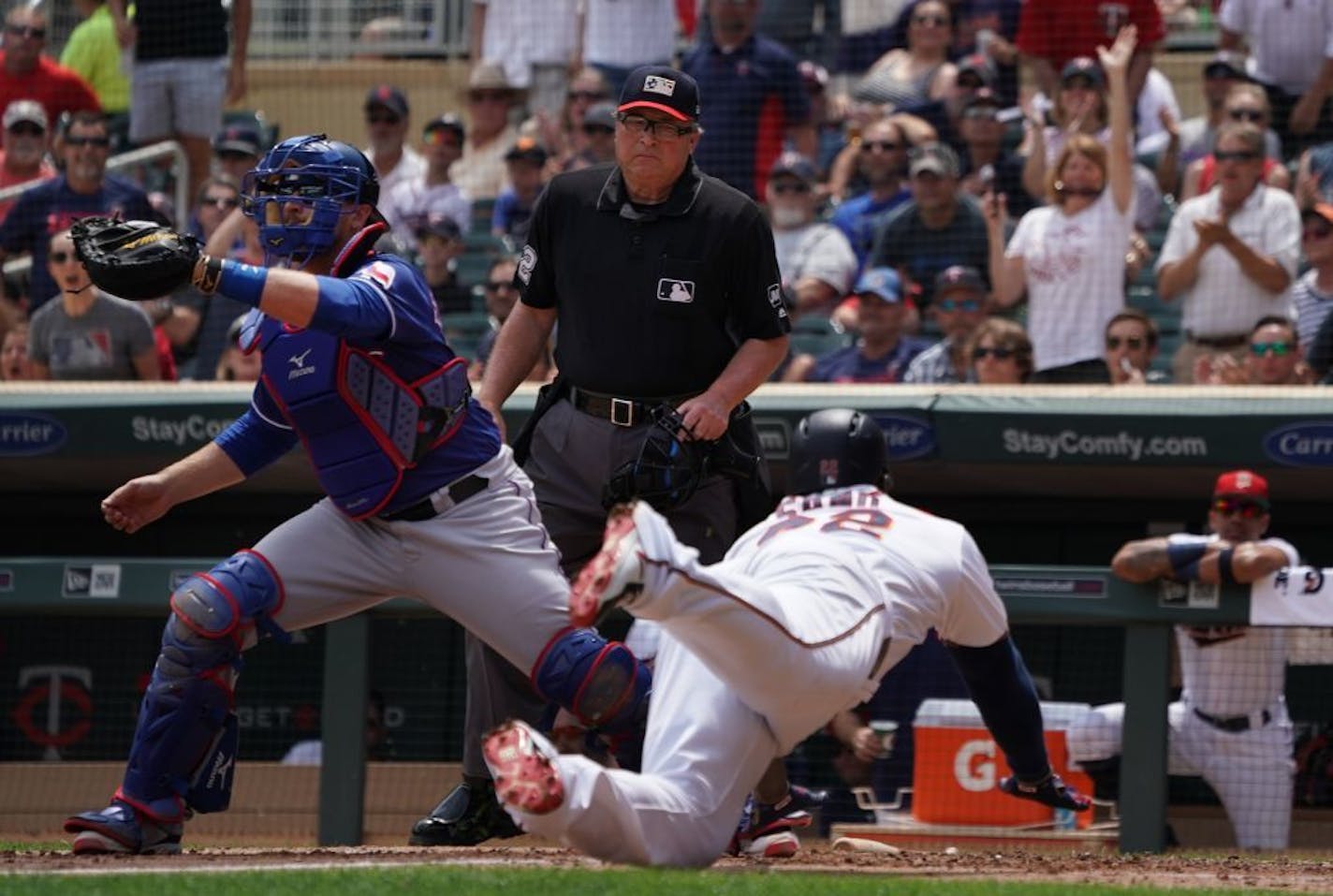 Miguel Sano(22) scores on Byron Buxton triple in the second inning.