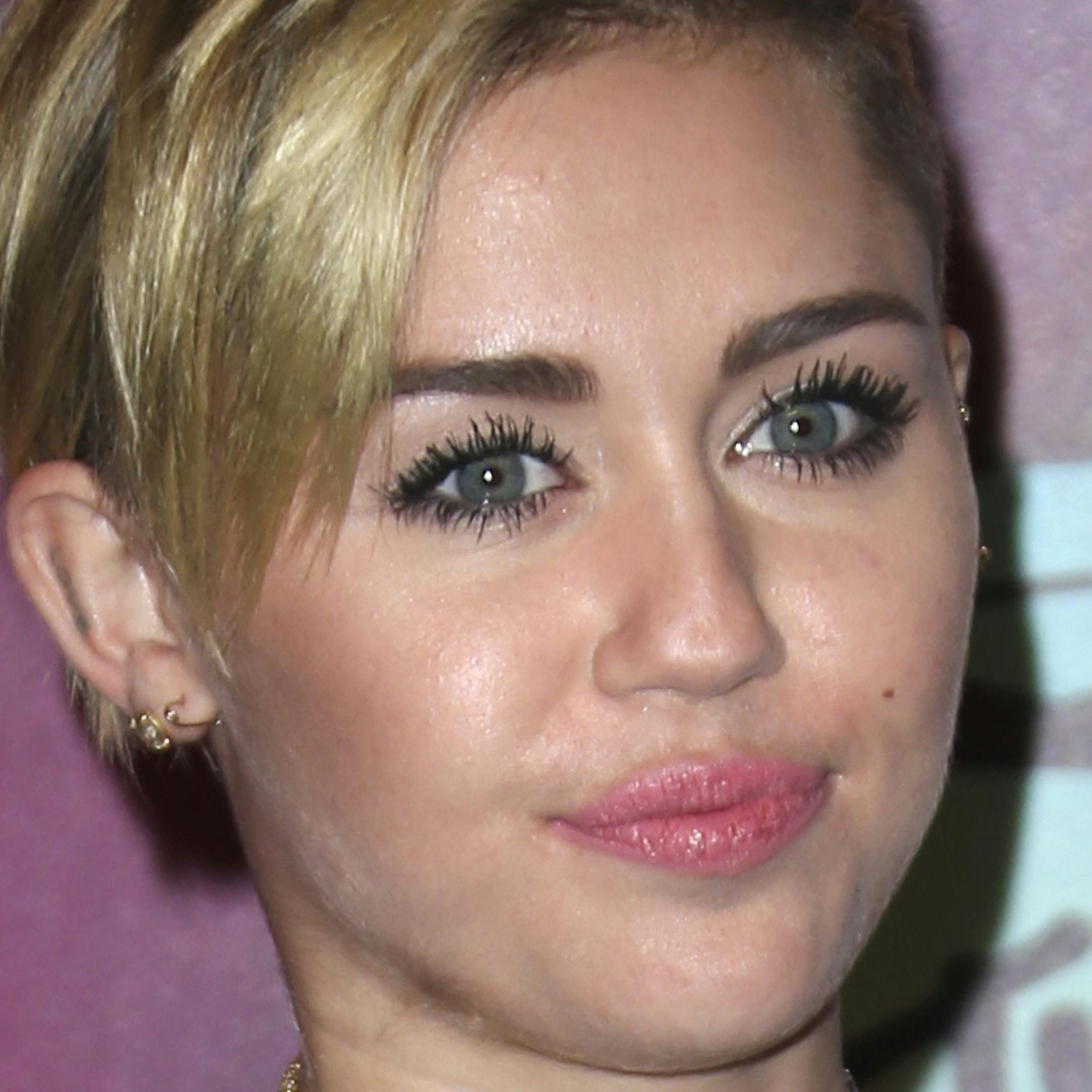 FILE - This Nov. 10, 2013 file photo shows Miley Cyrus at the 2013 MTV Europe Music Awards, in Amsterdam, Netherlands. It must be mentioned that Miley Cyrus embodied more than one fashion trend this year. Is Cyrus becoming a fashion icon? Not by the standard definition. But heading into 2014 she was one of the most-watched people on the planet. (Photo by Joel Ryan/Invision/AP, File)