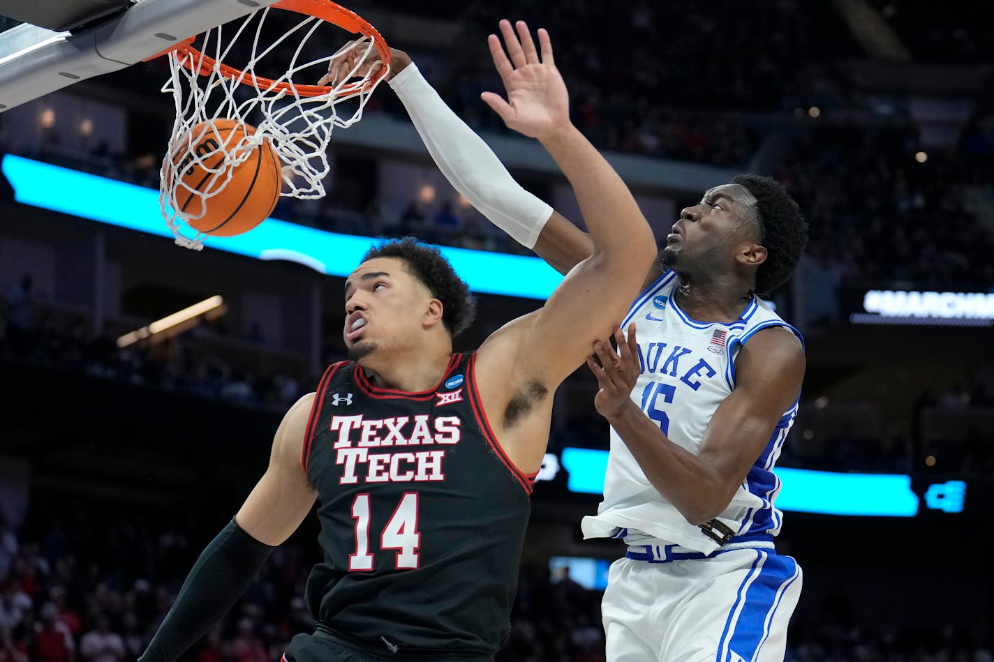 Duke center Mark Williams, right, dunks against Texas Tech forward Marcus Santos-Silva (14) during the second half of a college basketball game in the Sweet 16 round of the NCAA tournament in San Francisco, Thursday, March 24, 2022. (AP Photo/Tony Avelar)