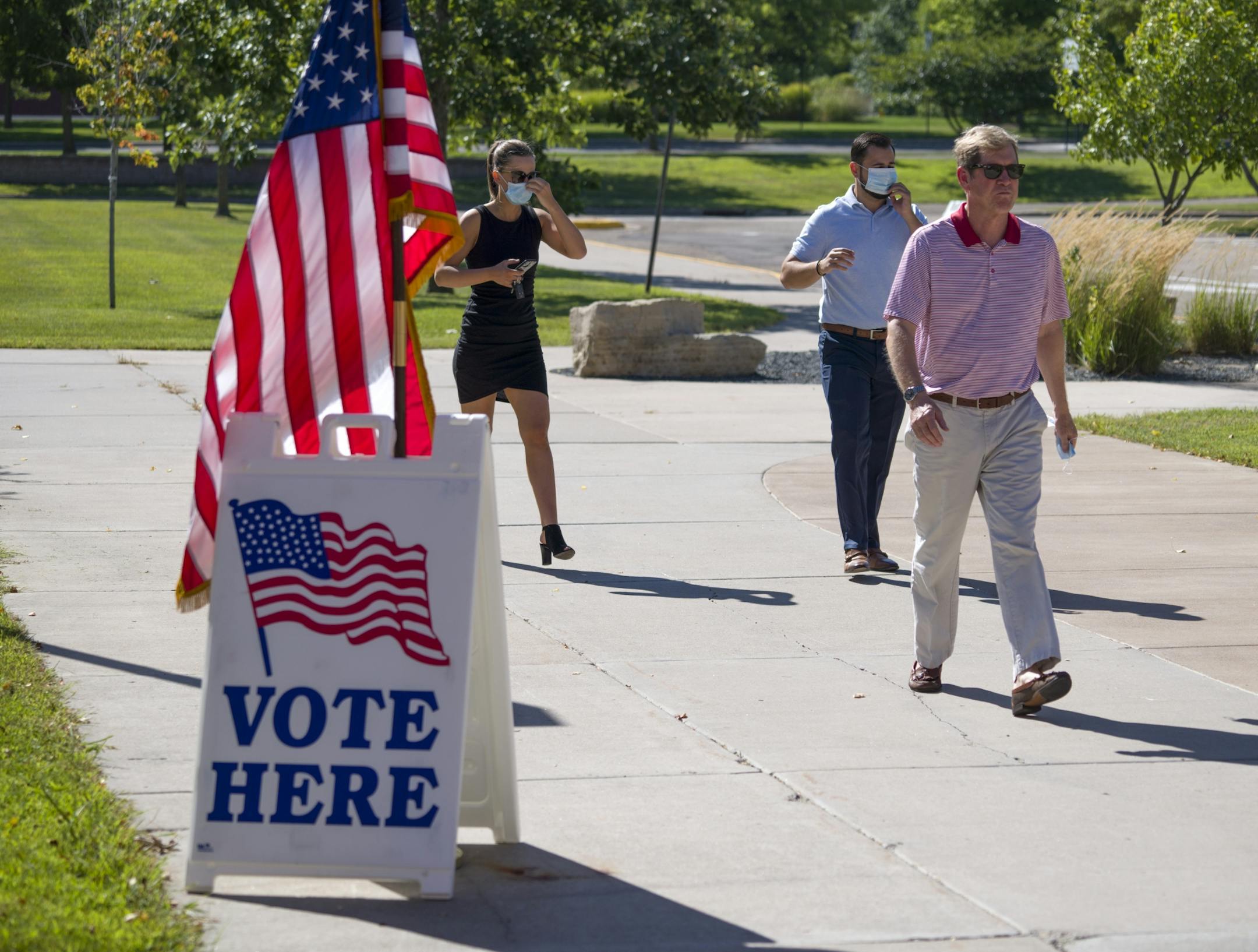 Jason Lewis cast his ballot at Liberty Ridge Elementary School in Woodbury Tuesday afternoon and slapped a "I voted" sticker on his chest after doing so.
