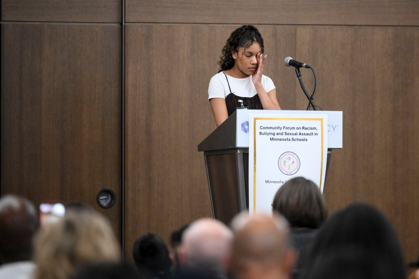 Mya Calvert, 16, a junior, fights back tears while discussing racism she's encounter while a student at Prior Lake High School during a community forum Thursday, Dec. 9, 2021 at the Hyatt Regency in Bloomington, Minnesota. The Minnesota Justice Coalition hosted a Community Forum on Racism, Bullying and Sexual exploitation/harassment in Minnesota Schools. The forum featured students who were the targets of racism in their schools. ] AARON LAVINSKY • aaron.lavinsky@startribune.com