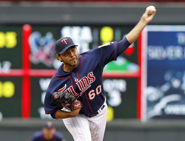 Minnesota Twins starting pitcher Pedro Hernandez (60) delivers to the Tampa Bay Rays during the third inning of a baseball game, Sunday, Sept. 15, 201
