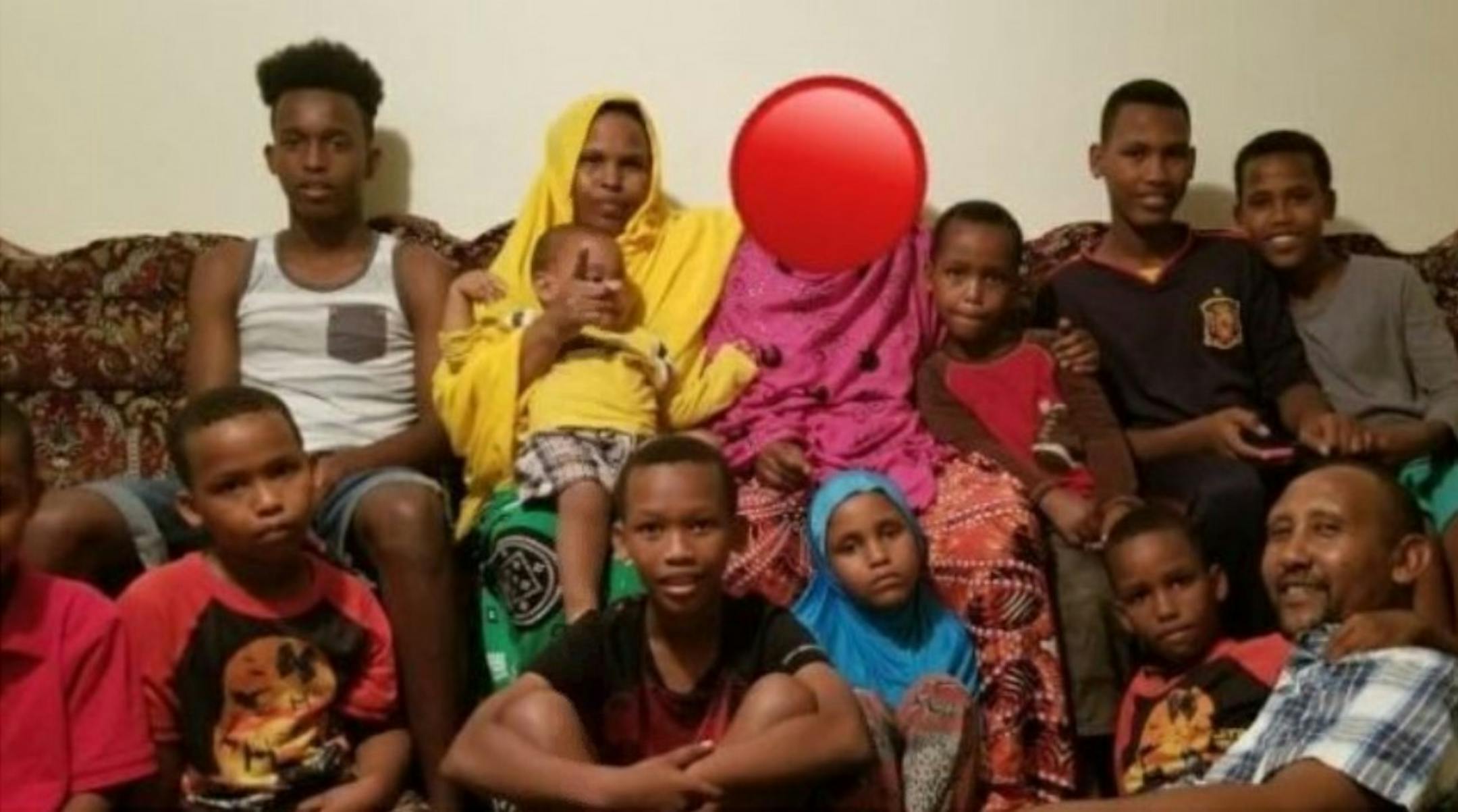 Ubah Hussein, 39, in yellow, was a mother of 10 with another child on the way. Her husband, Tamam Kharow, was seriously injured.