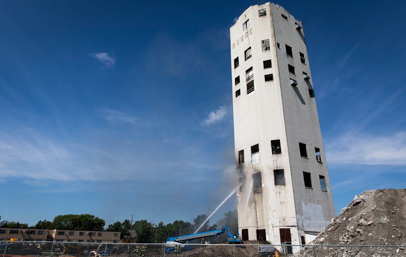 Minneapolis firefighters battle a fire in the Bunge grain elevator structure. ] LEILA NAVIDI � leila.navidi@startribune.com BACKGROUND INFORMATION: Firefighters arrived around 10:45 a.m. to find heavy smoke coming from the Bunge grain elevator, a structure near Van Cleve Park in Minneapolis on the 1200 block of Brook Avenue SE, on Friday, June 1, 2018.