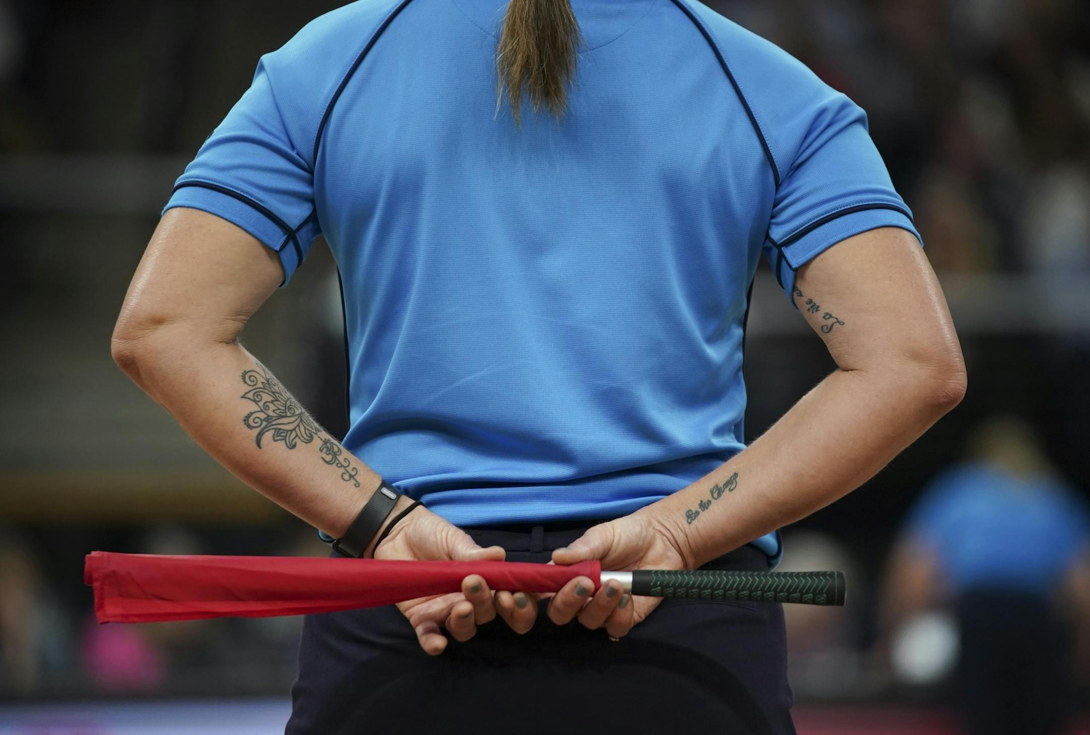 A referee stood by during a timeout during the third set between Stanford and BYU.