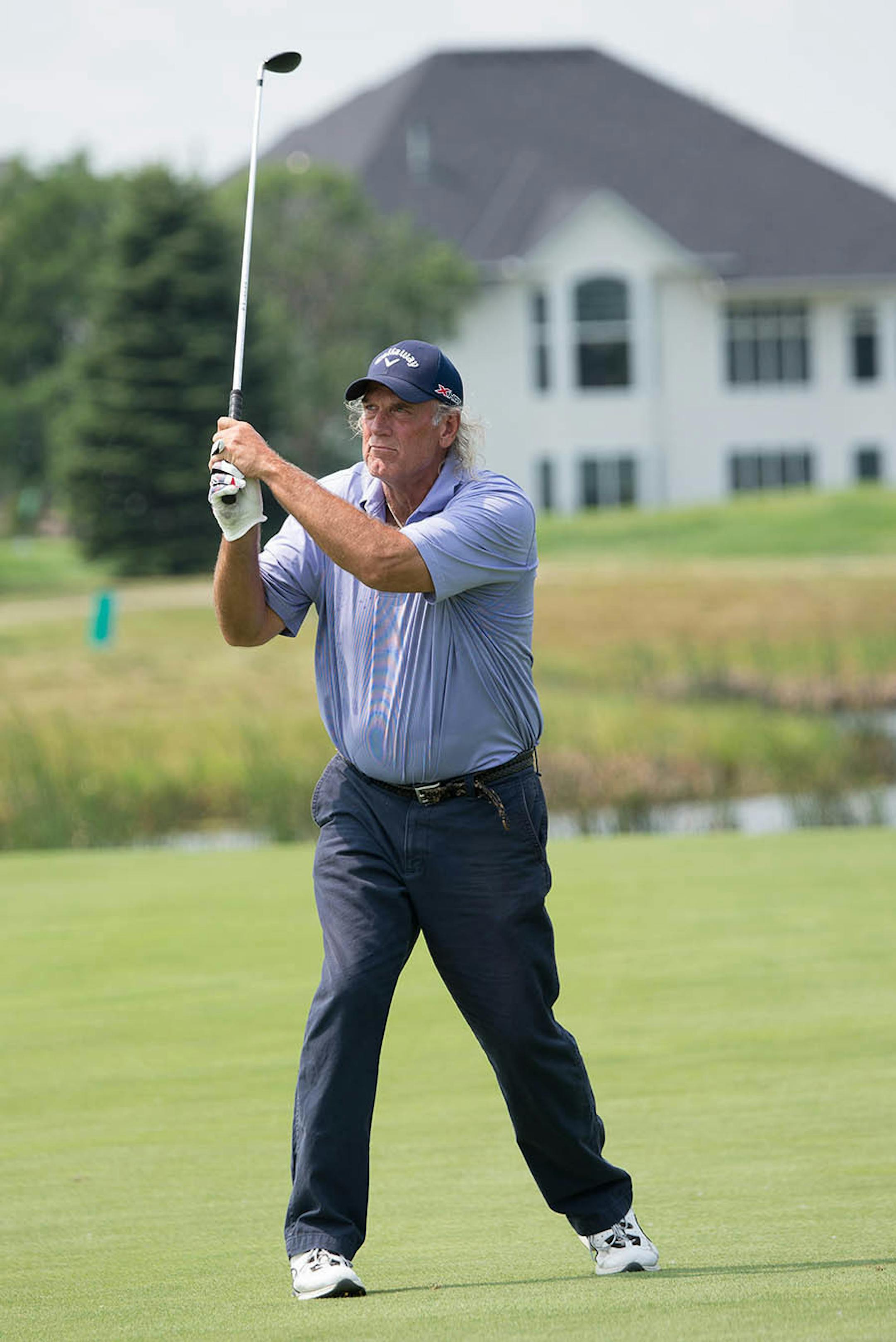 Jesse Ventura plays as an amateur with pro Bob Gilder in the Insight Pro-Am event during the 3M Championship tournament at the TPC Twin Cities in Blaine, Minnesota on July 30, 2014.
