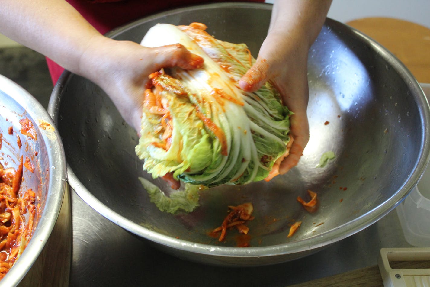 Amy Thielen ¥ Special to the Star Tribune Minam Morris prepares traditional Korean kimchi.